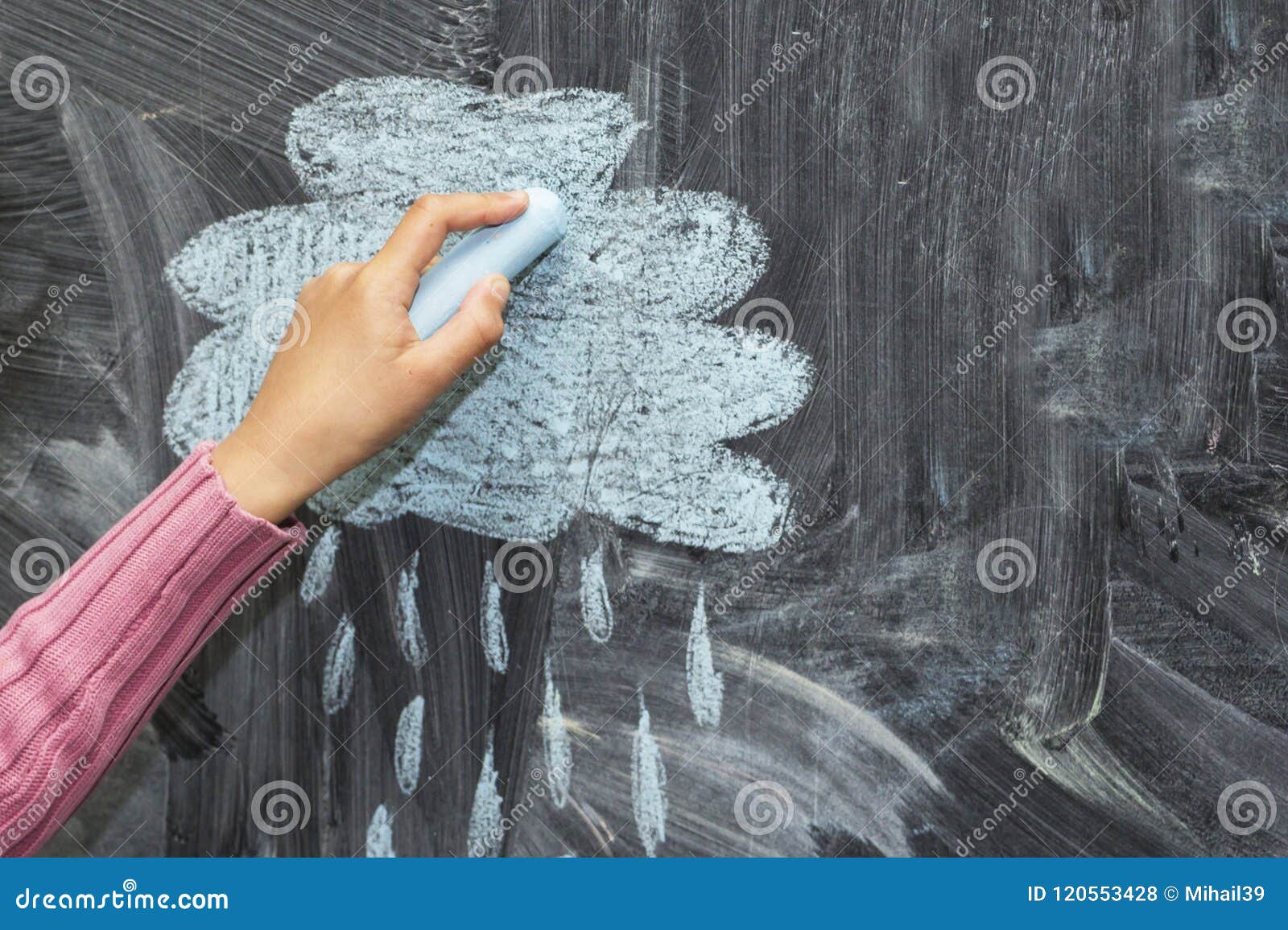 A Cloud and a Rain Drawn with Chalk on a Blackboard. Stock Photo