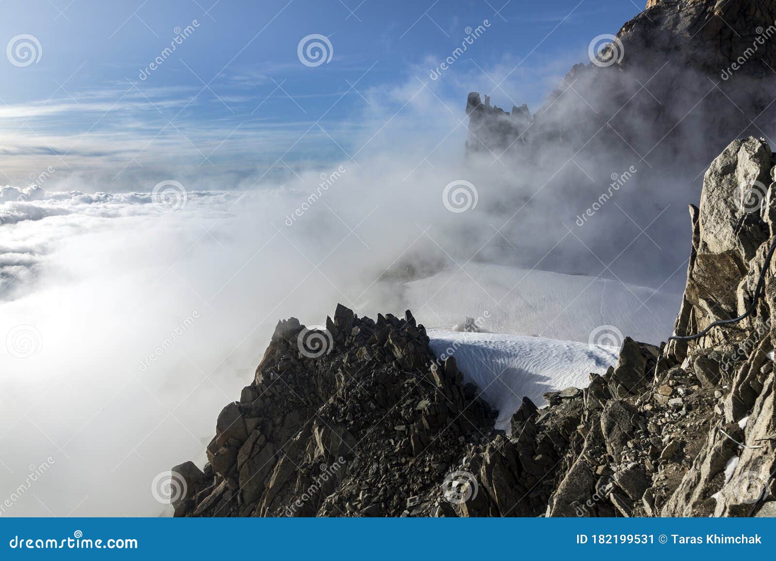 clouds and fog near aiguille du midi. view from the cosmique refuge, chamonix, france.