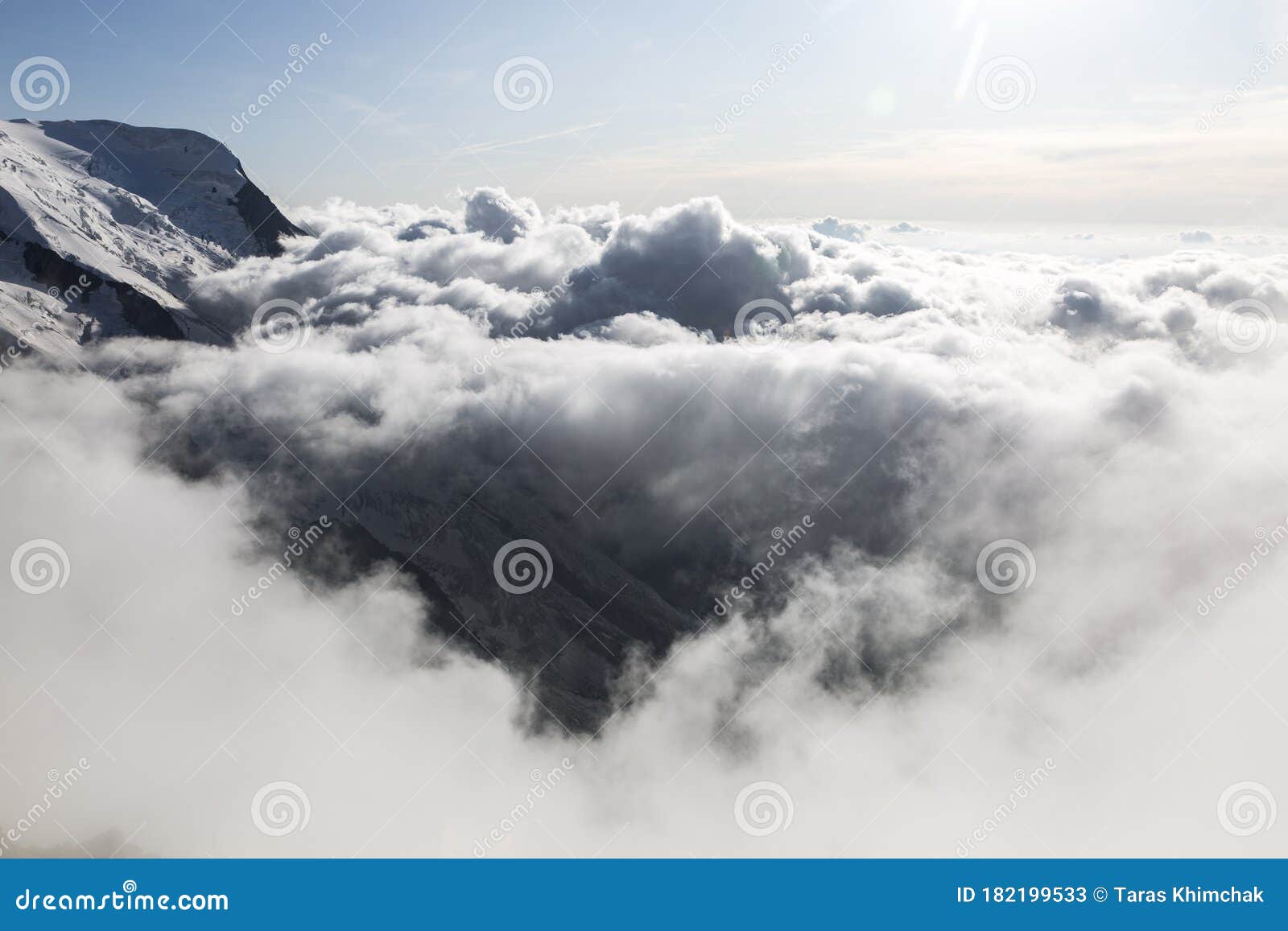 clouds and fog over the chamonix valley. view from the cosmique refuge, chamonix, france.