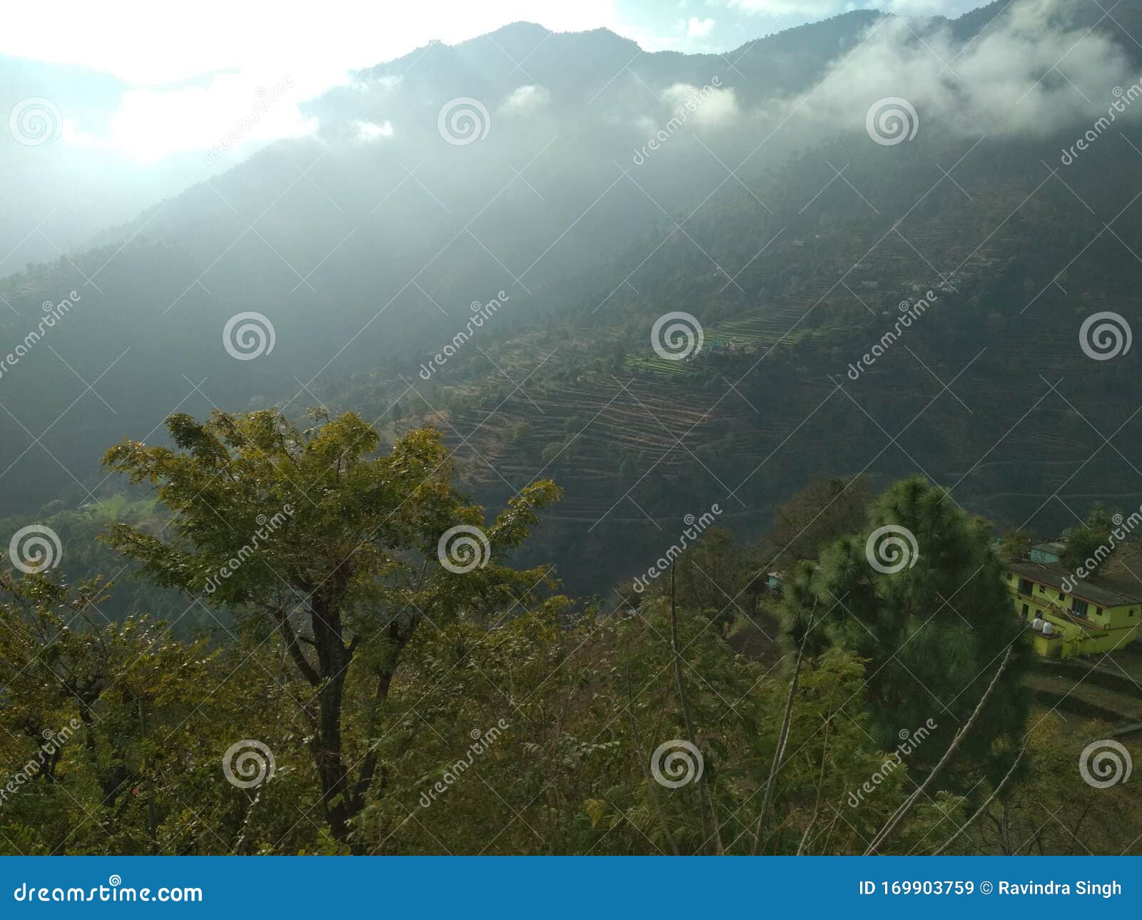 clouds and mountains meeting in himalayan region  in india