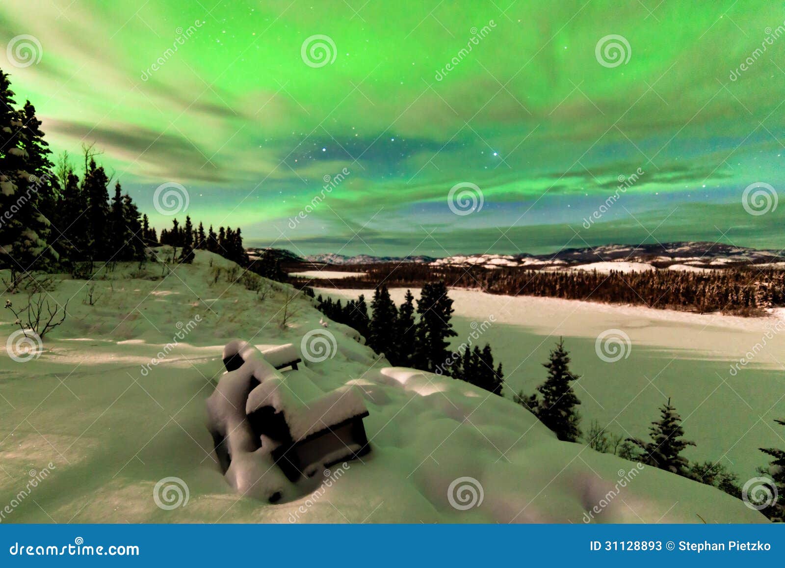 clouds and northern lights over lake laberge yukon