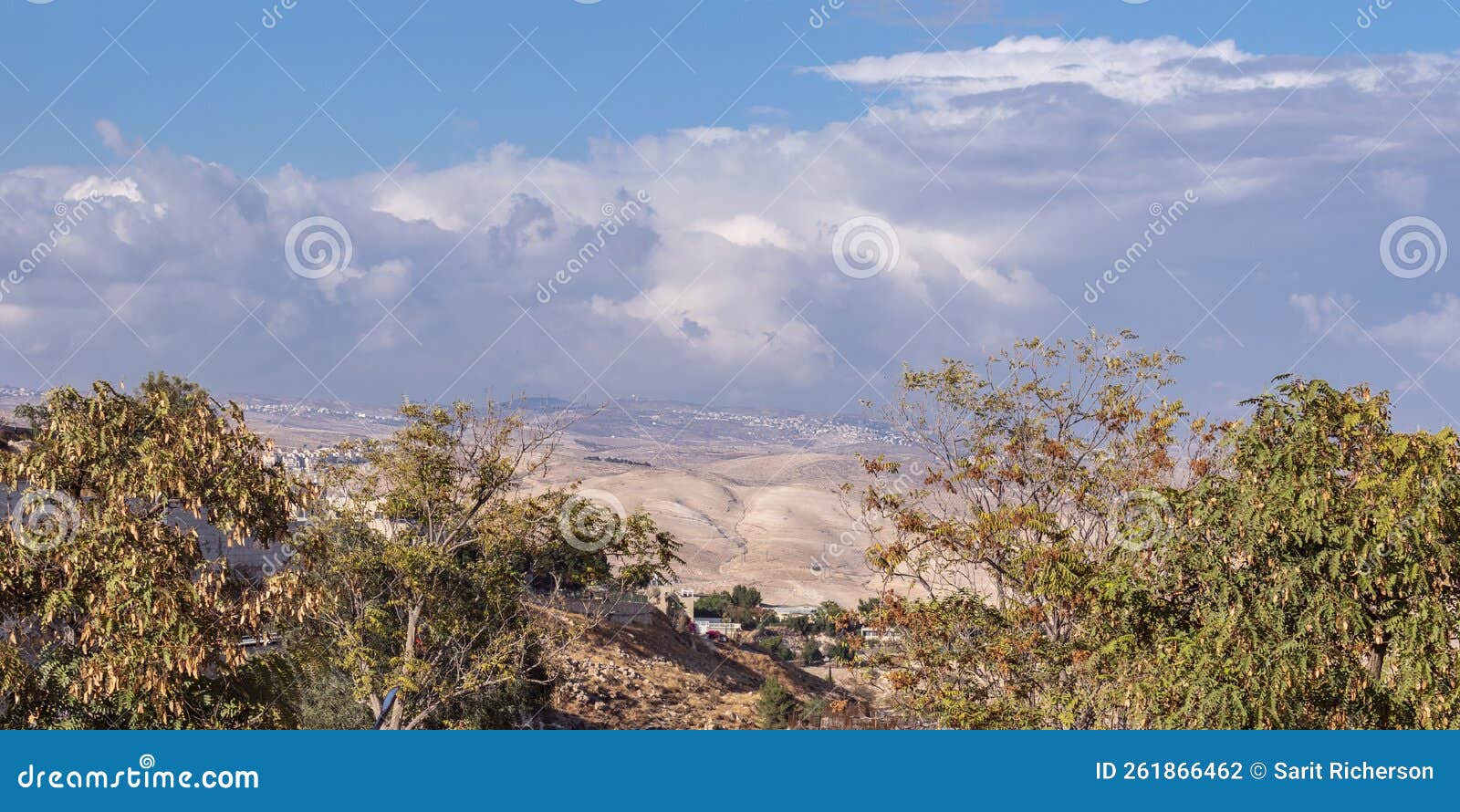 clouds over the judean mountains with palestinian towns and villages in the background