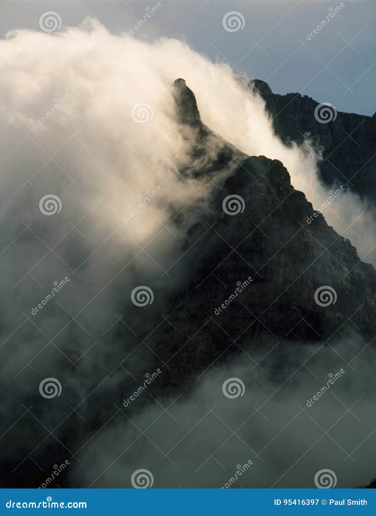 clouds smothering peaks of the lewis range, highline trail, glacier national park, montana