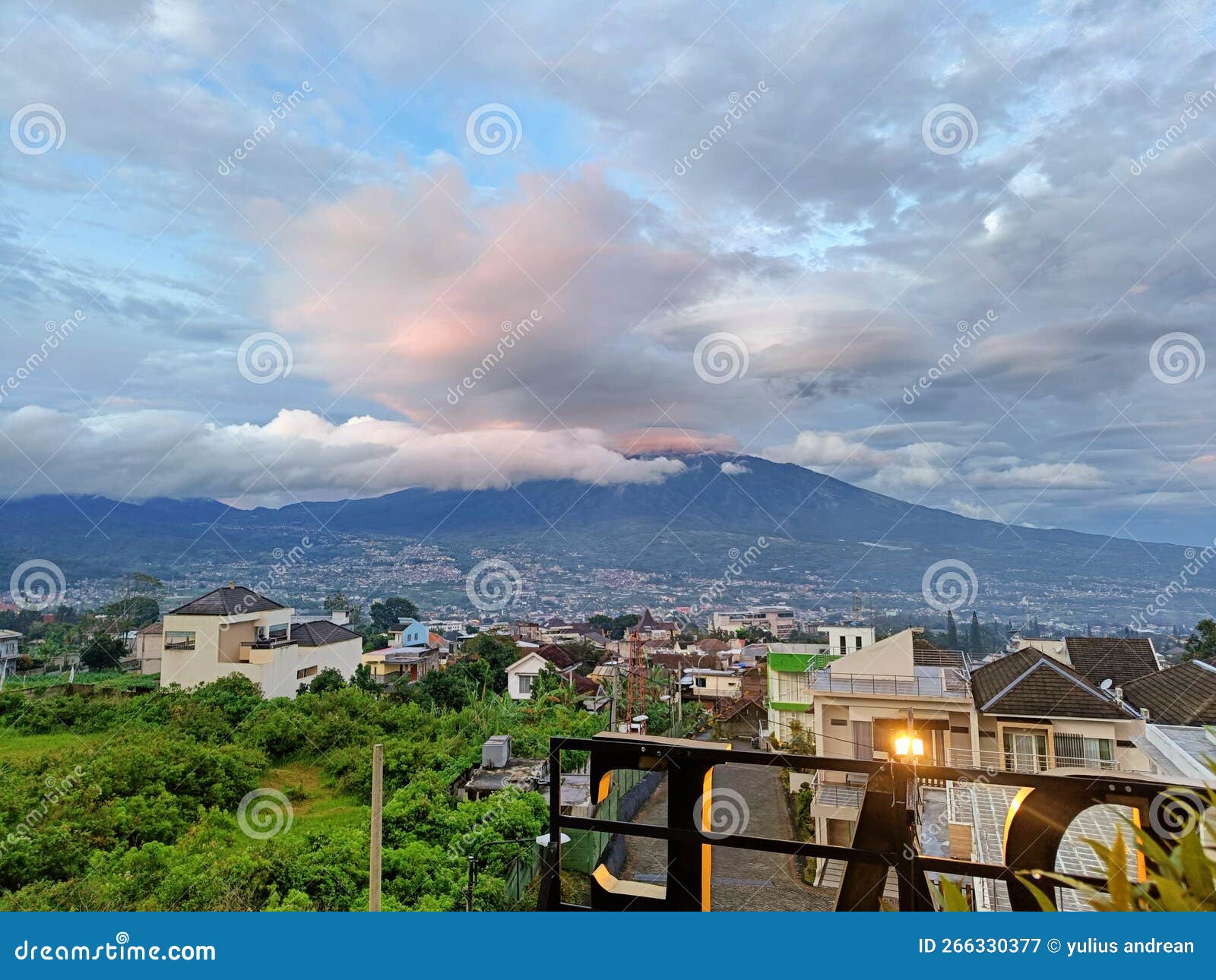 Cloudy on Arjuna Mountain at Sunset View Stock Image - Image of sunset ...