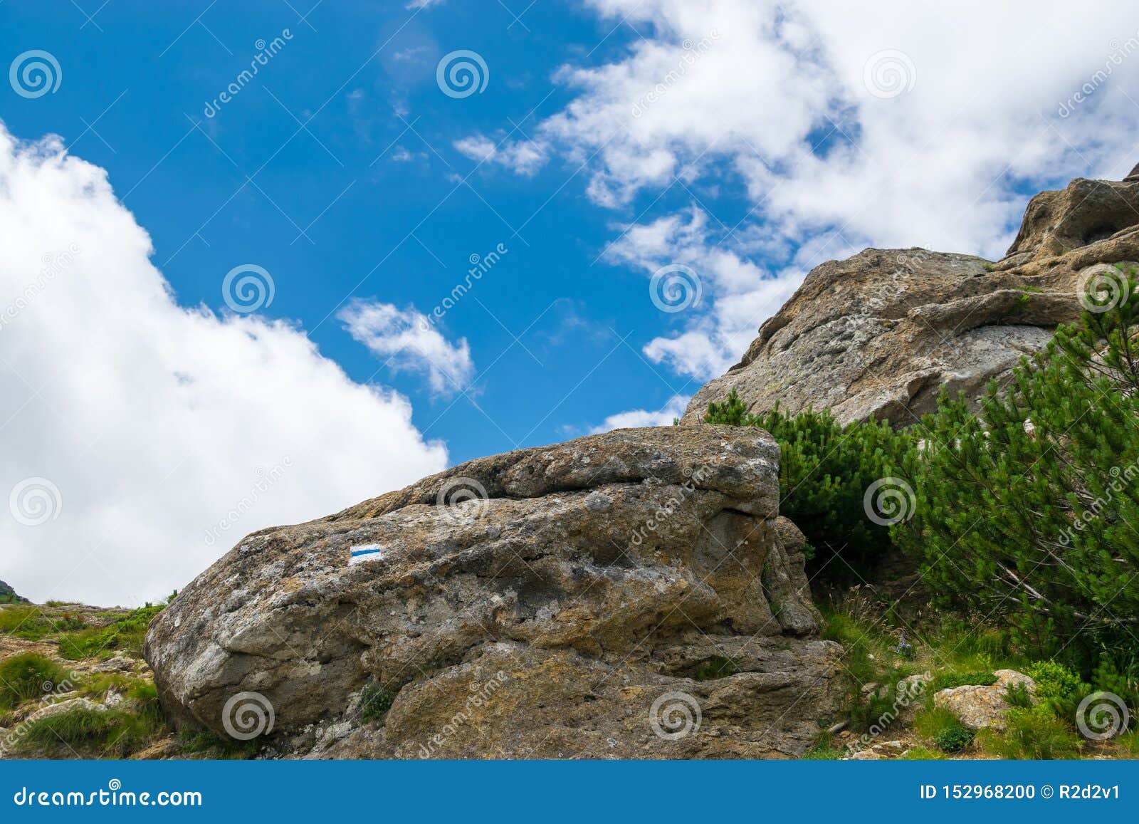 cloudy blue sky and rocks