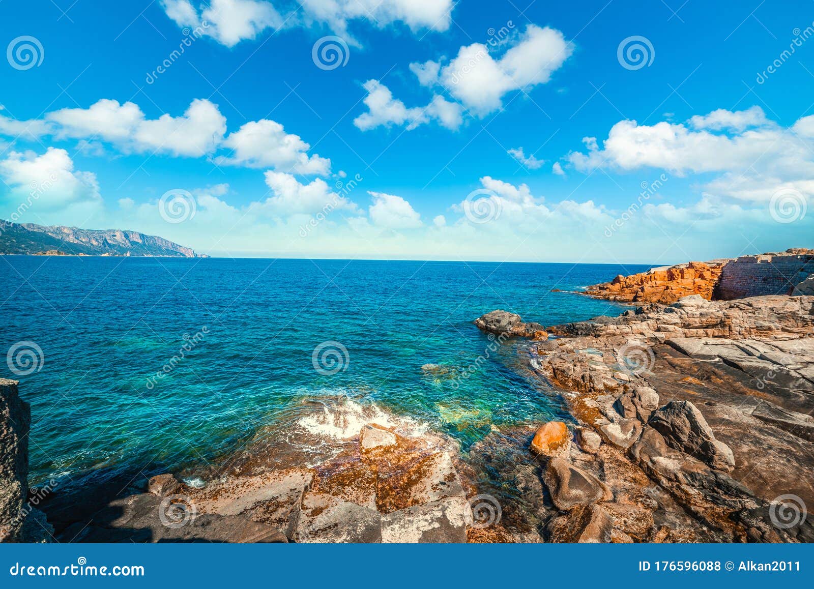 cloudy sky over rocce rosse shore in sardinia