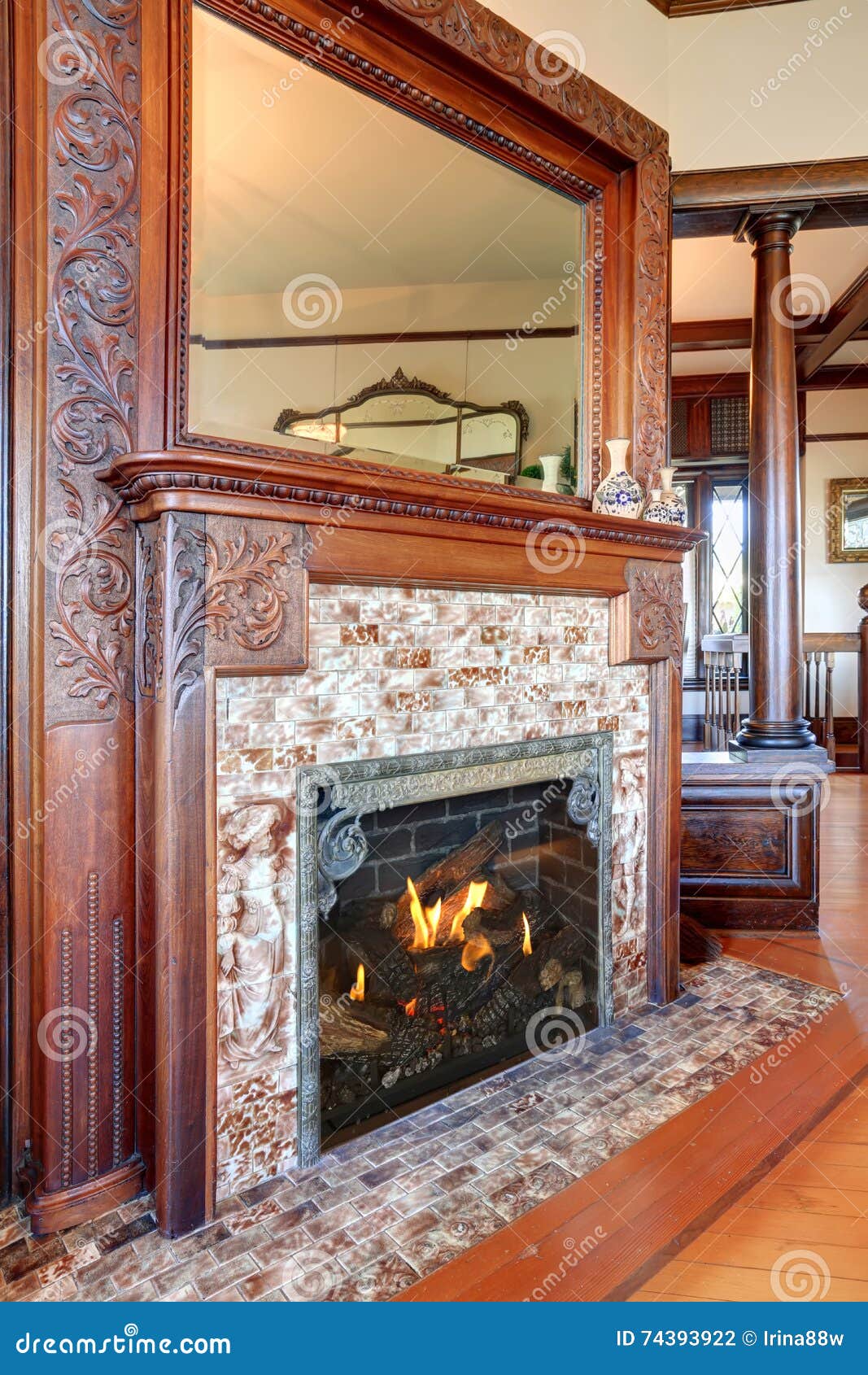 Clouse Up View Of Antique Fireplace With Decorative Tile Trim