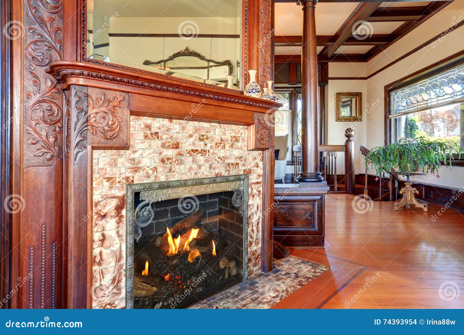 Clouse Up View Of Antique Fireplace With Decorative Tile Trim