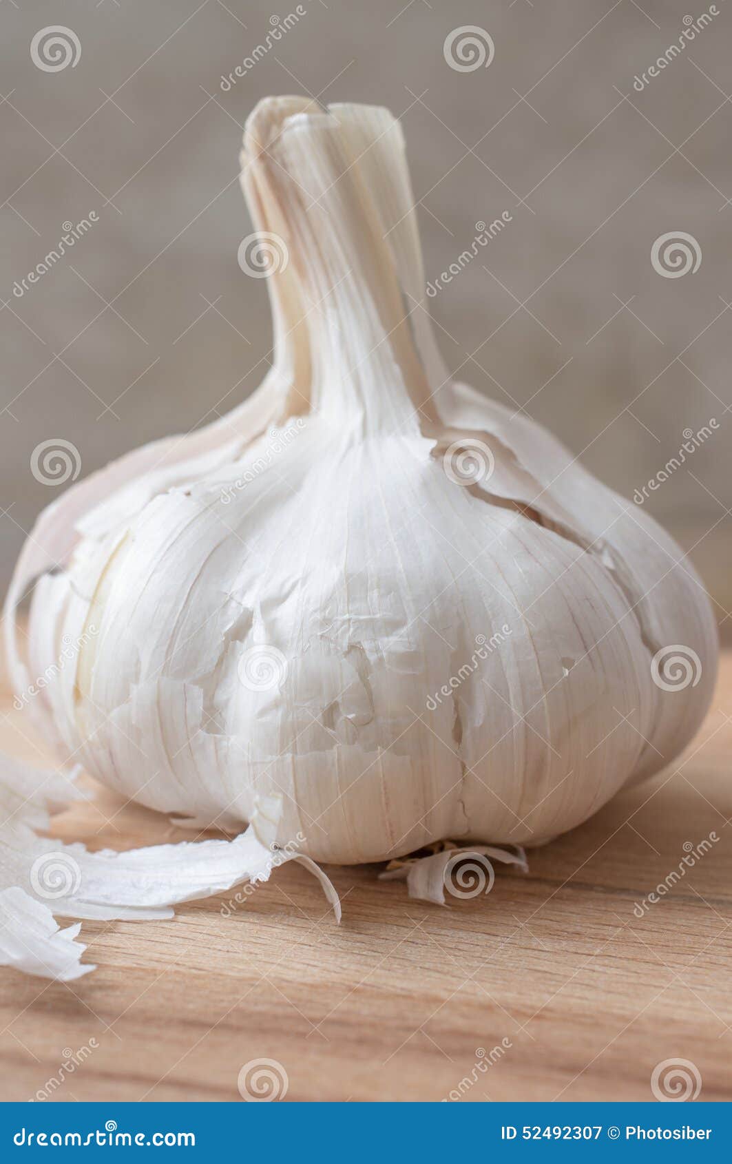 Clove Of Garlic On A Brown Wood Texture Stock Image 185239273