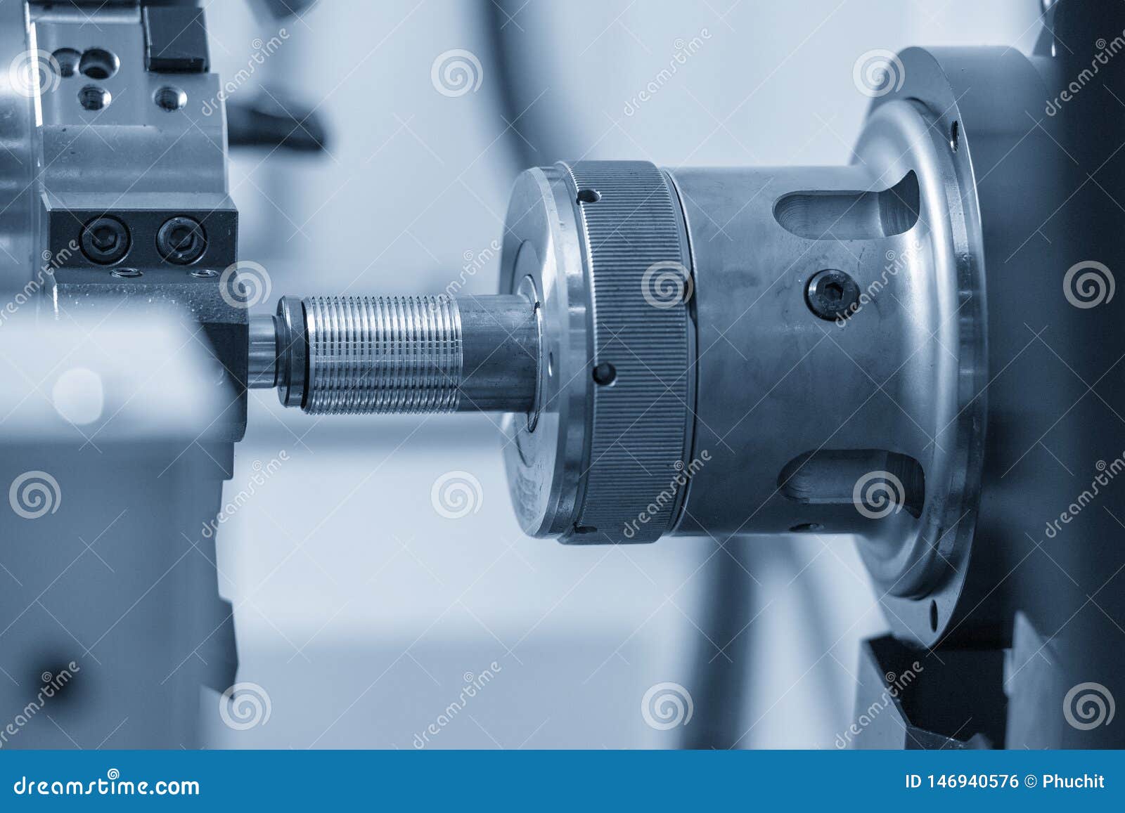 The CNC Lathe Machine Cutting the Thread at the Water Pipe. Stock Photo