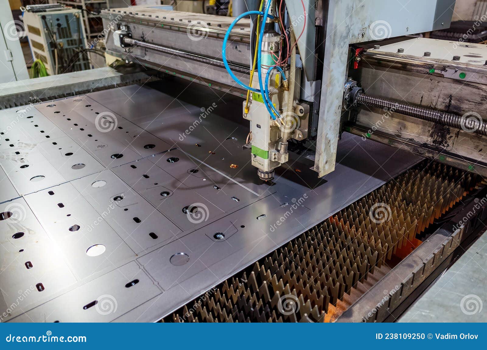 CNC Machine for Laser Cutting Sheet Metal in a Production Area, Close