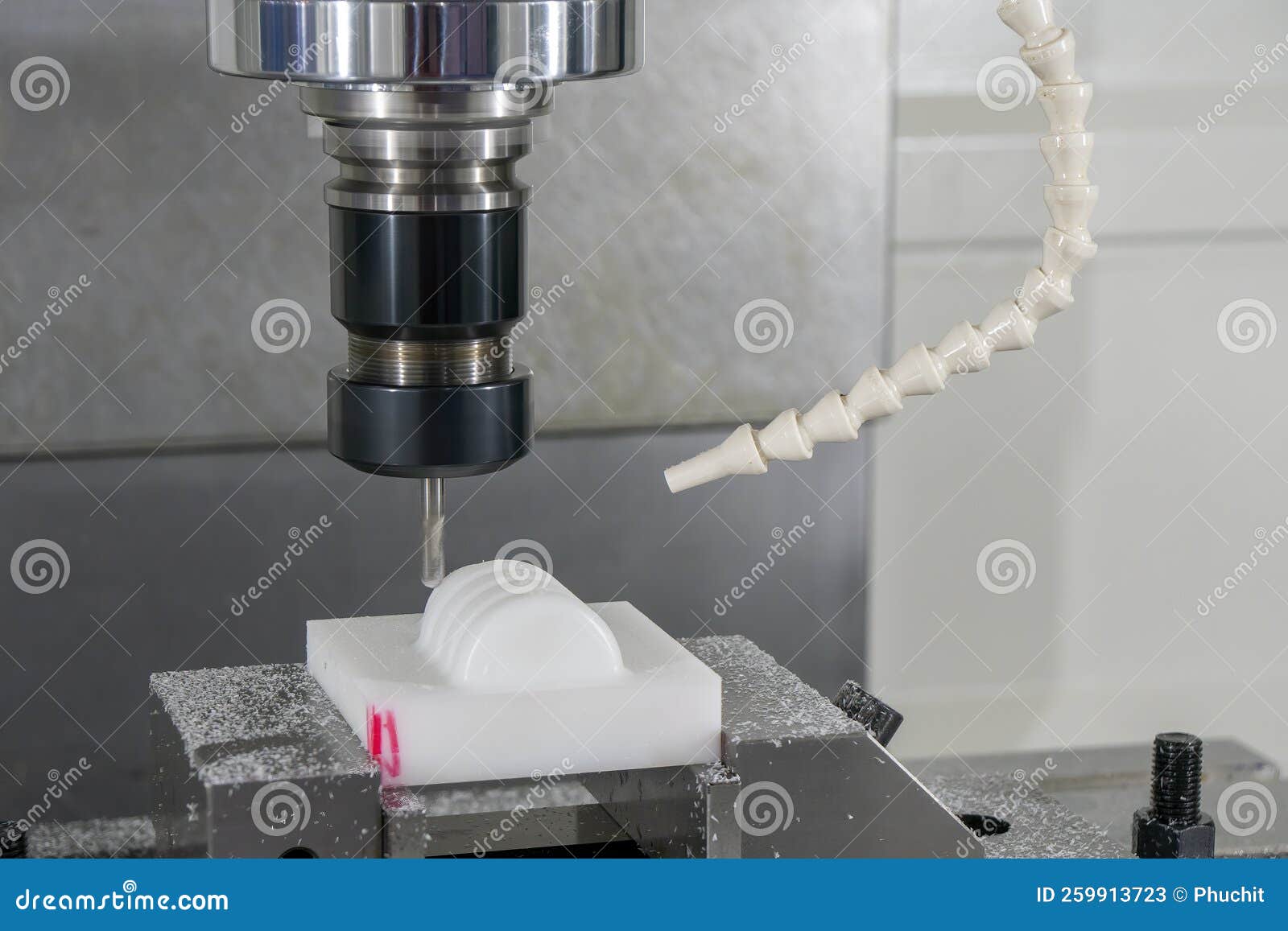the  cnc milling machine cutting the nylon 6 material part with ball end mill tool