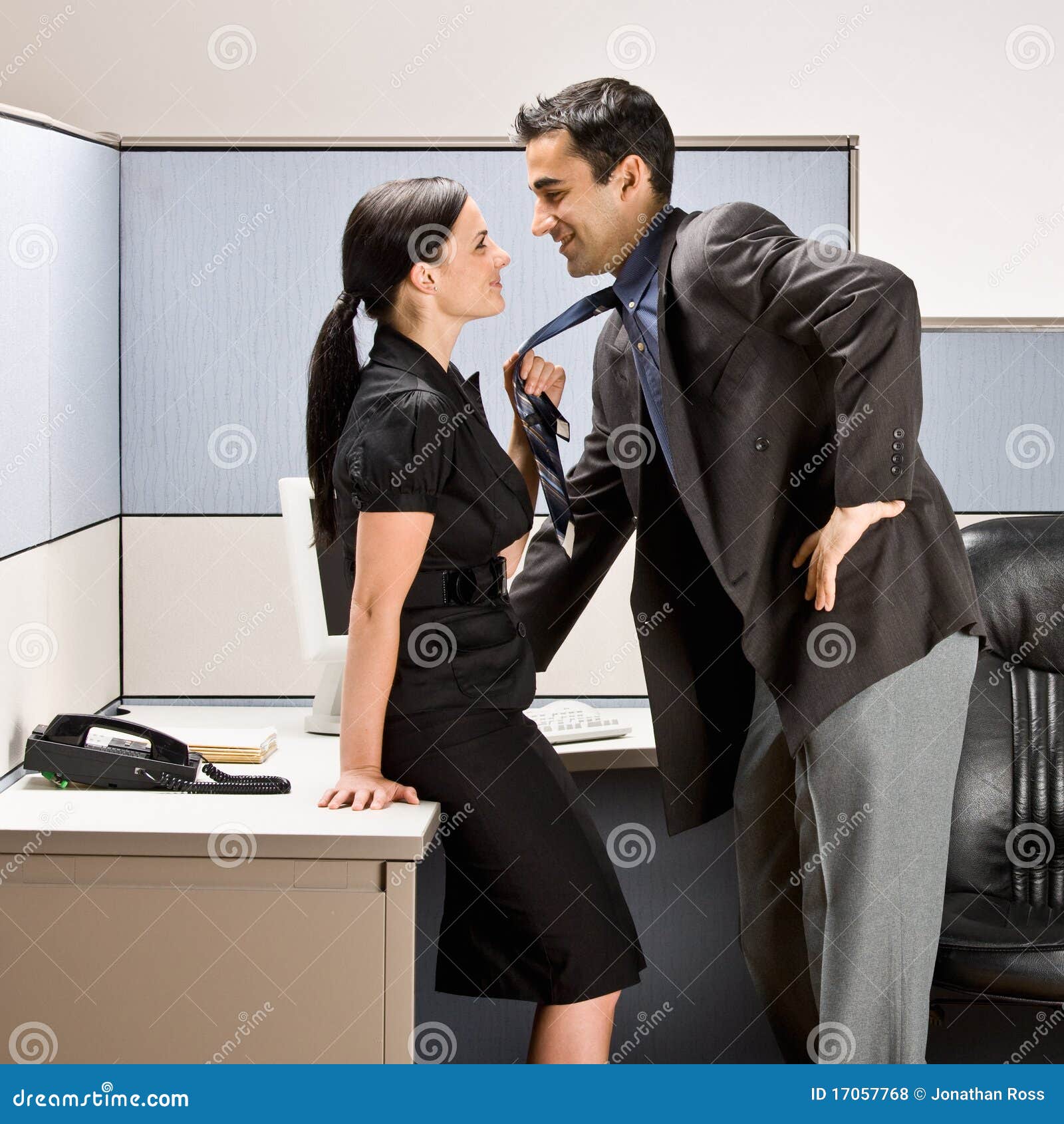 Co Workers Kissing In Office Cubicle Royalty Free Stock