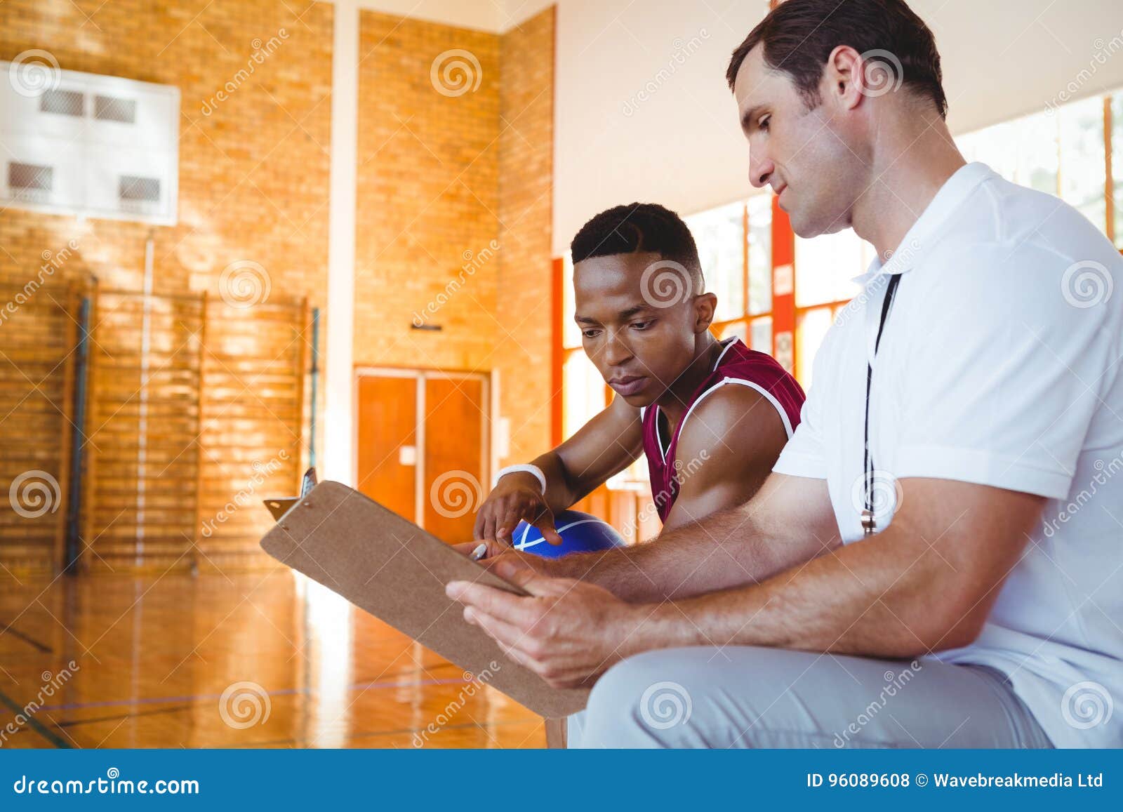 Coach Explaining To Basketball Player Stock Photo Image of activity