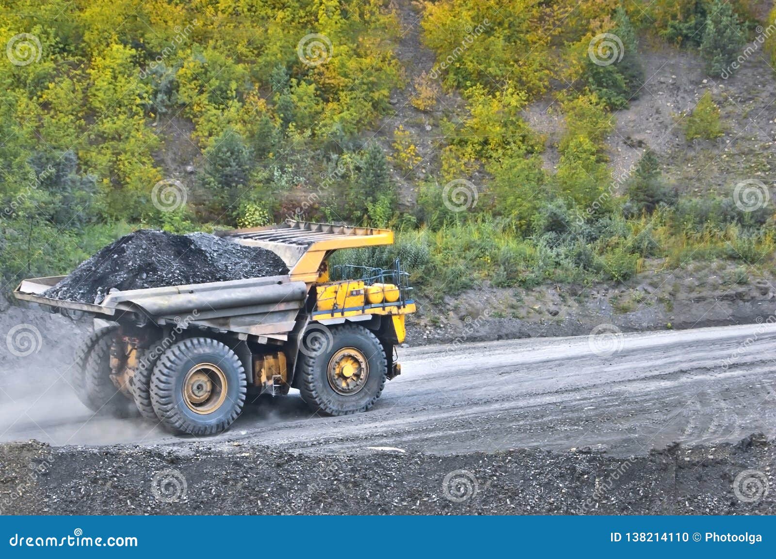 Coal in the Back of the Yellow Truck. Coal Mining. Coal Delivery. Stock