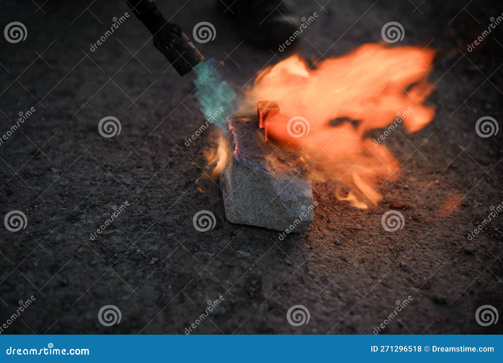 Coal on Fire. Ignition of Square Coal with a Gas Burner on a Stone