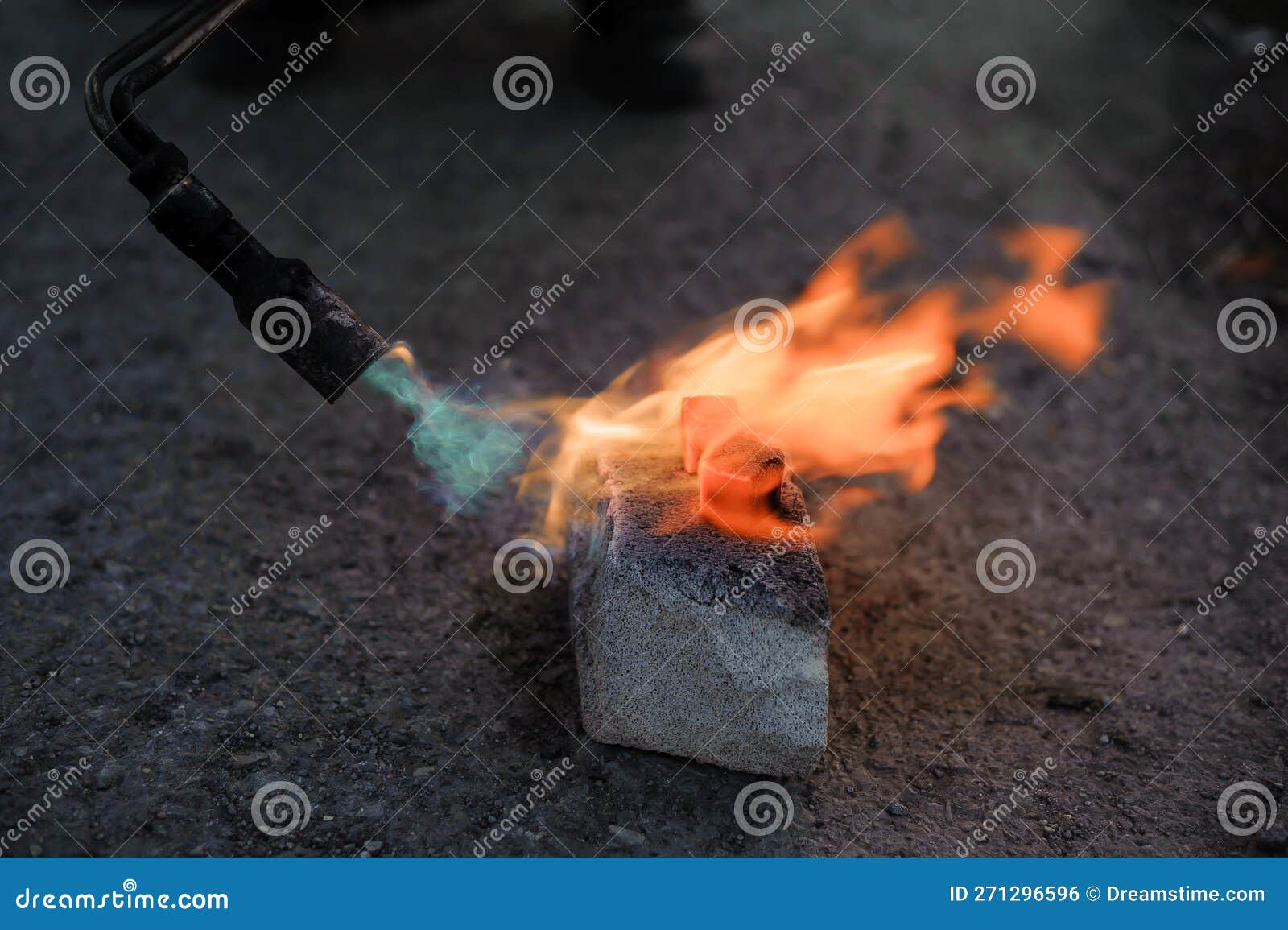 Coal on Fire. Ignition of Square Coal with a Gas Burner on a Stone