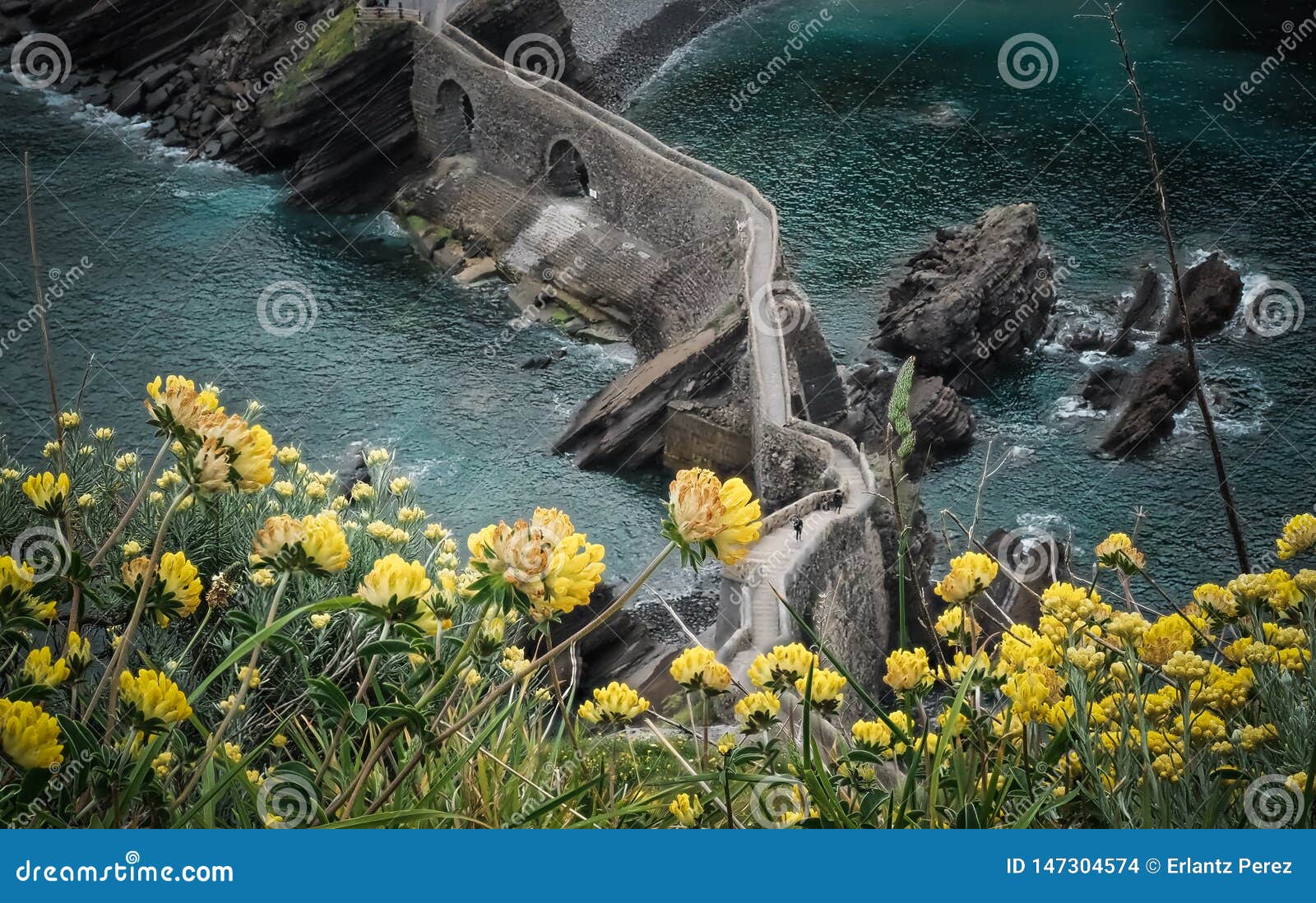 the coast from san juan de gaztelugatxe, dragon-stone in game of thrones, bridge and stone stairs