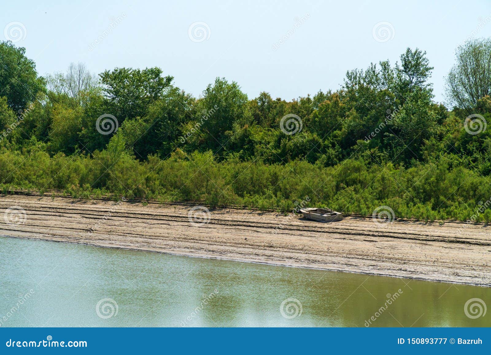 Coast of a wide flat river stock image. Image of nature 150893777