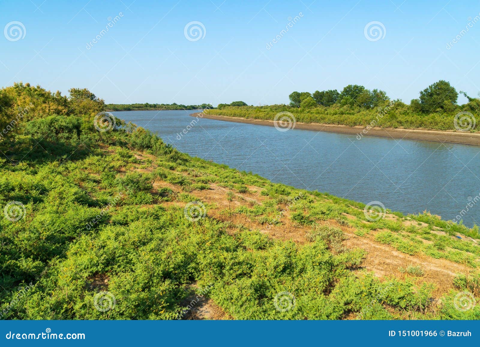 Coast of a wide flat river stock photo. Image of ground 151001966