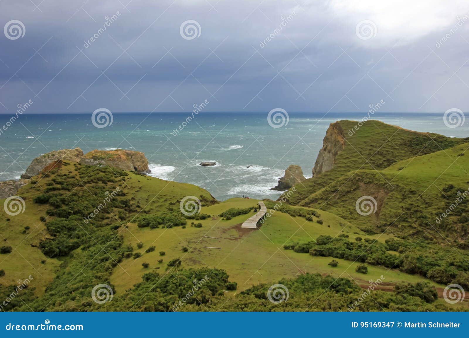 coastal view of the muelle de las almas, ocean in the background, chiloe island, chile