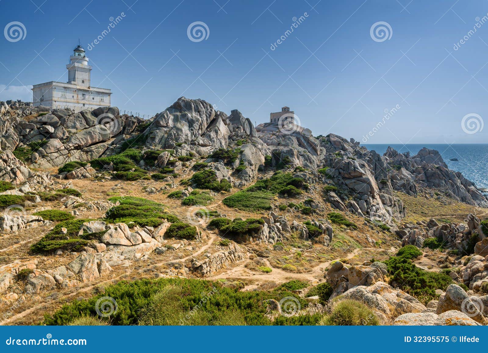 coastline and lighthouse in capo testa, sardinia, italy
