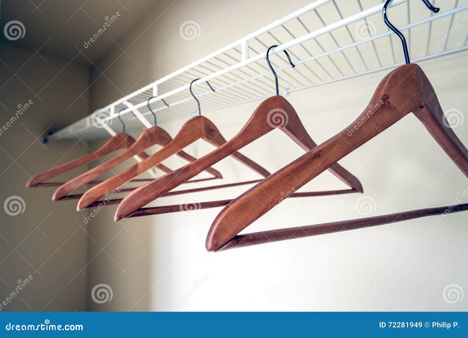 coat hangers in an empty closet.