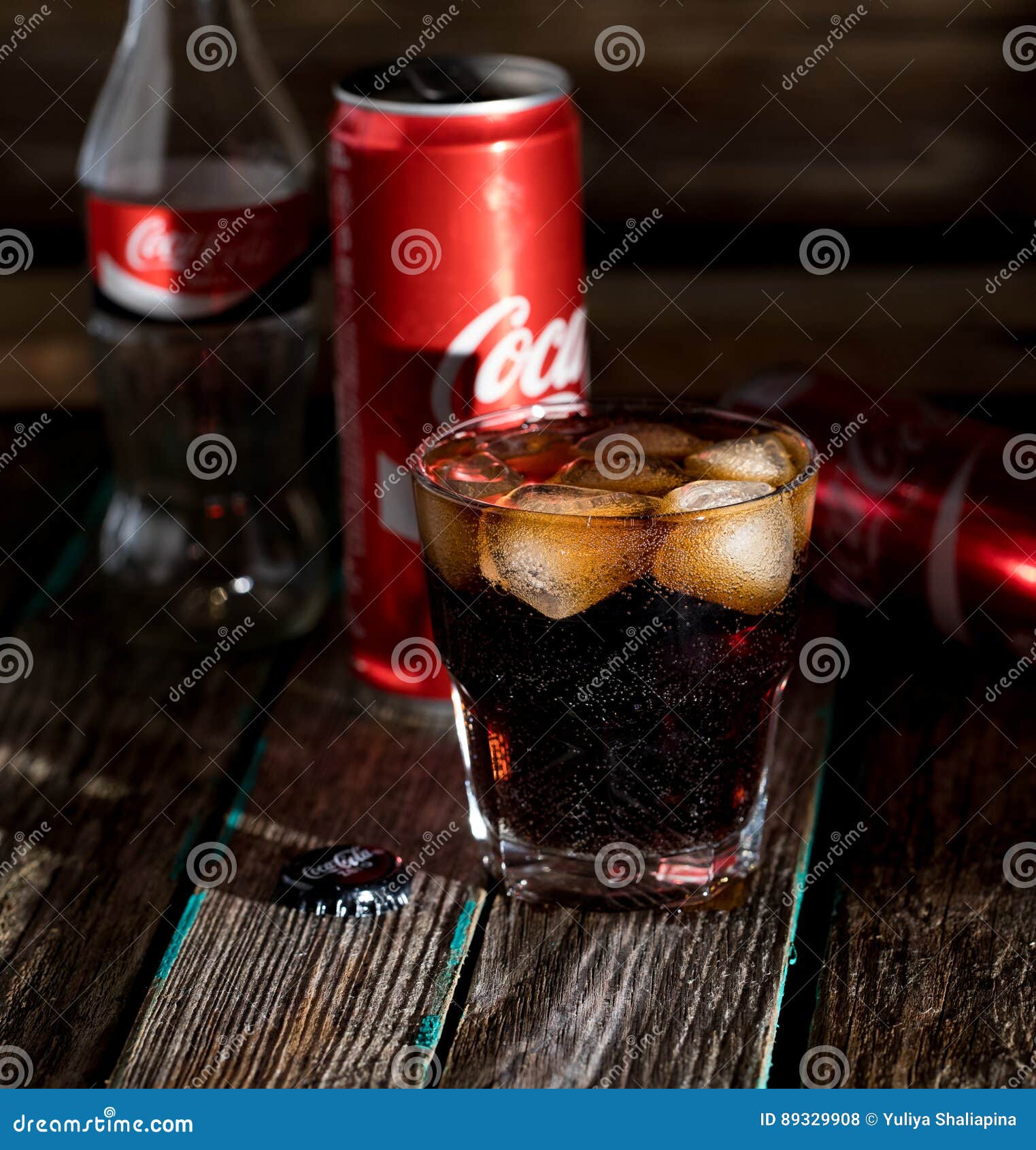 Coca Cola with Ice, Bottle, Glass, Cup Editorial Stock Photo