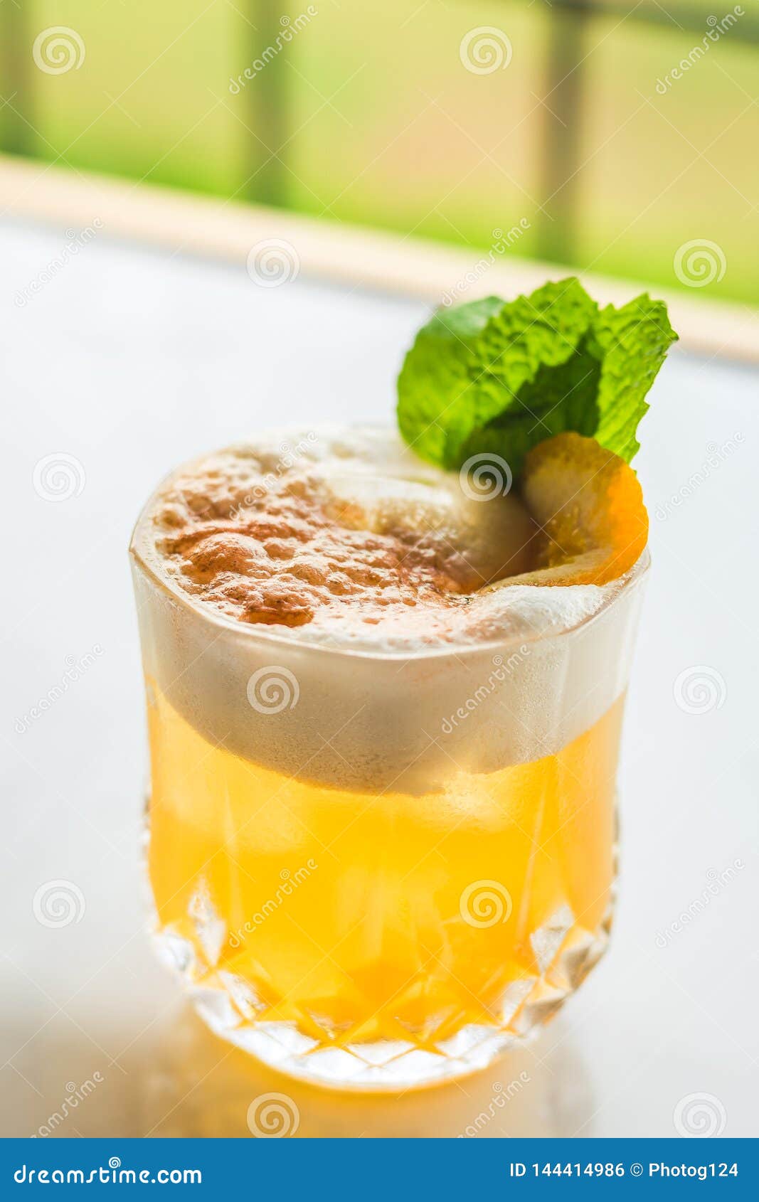 Cocktail with Orange Bitter and Orange Peel and Mint Leave Stock Photo