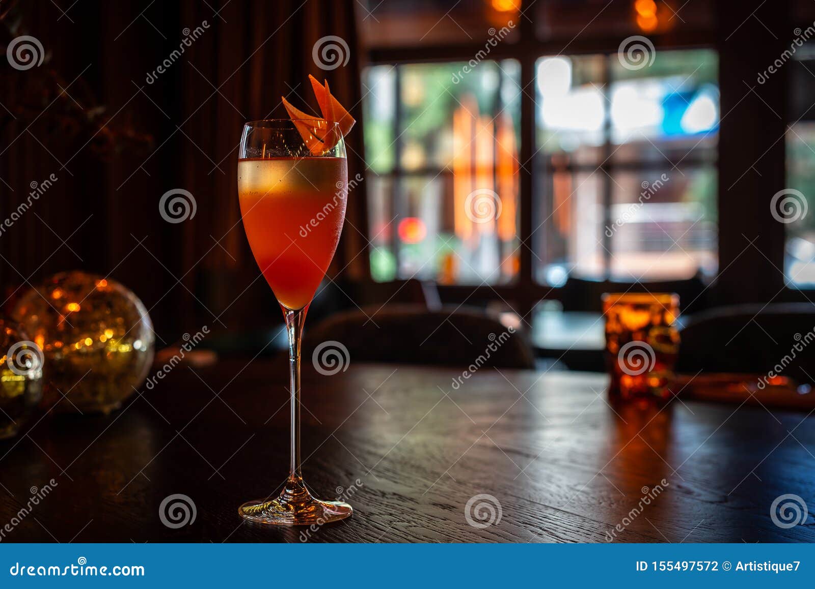 Cocktail with Orange Peel Decoration on the Table Stock Photo Image