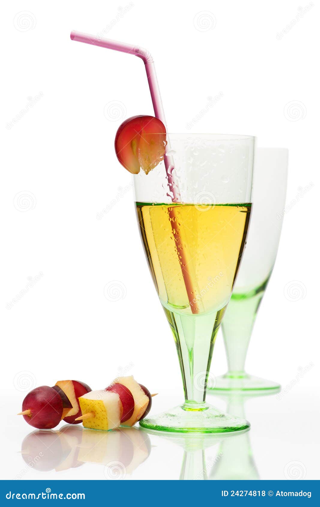 Cocktail still life with colored glass, drink and canape n on a white background