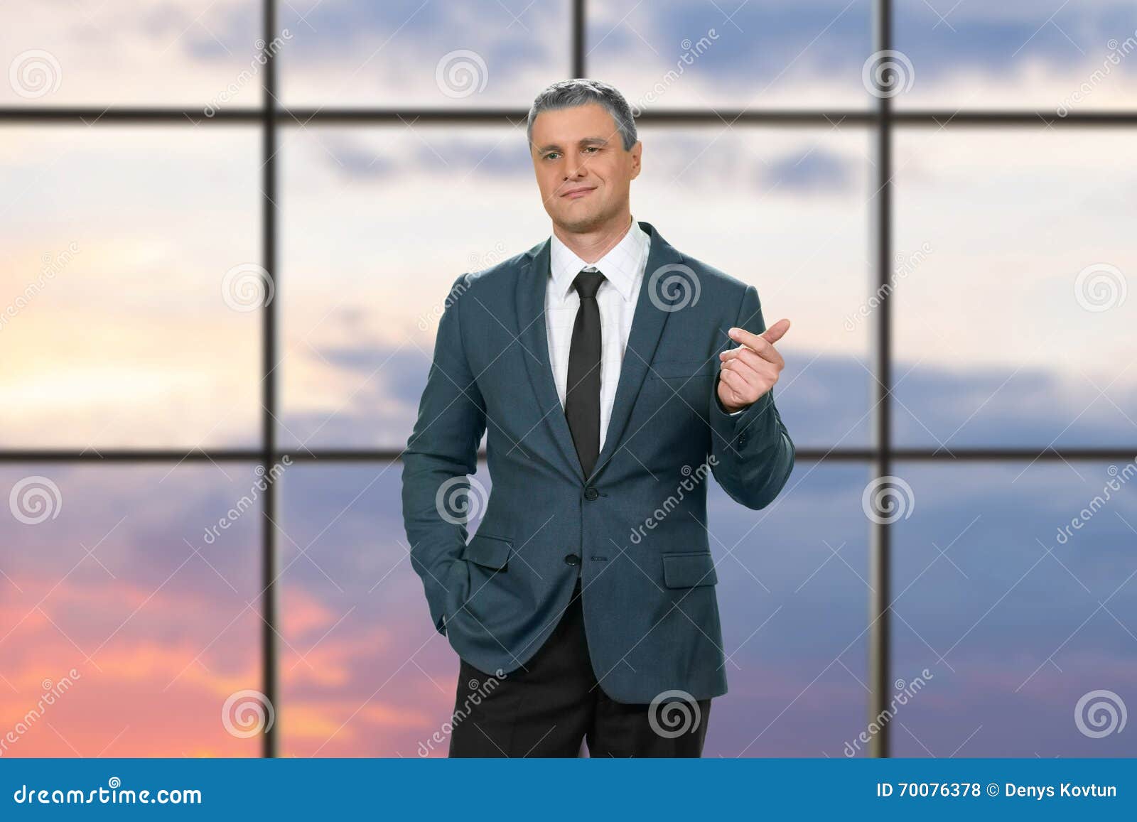 cocky adult businessman wearing suit.