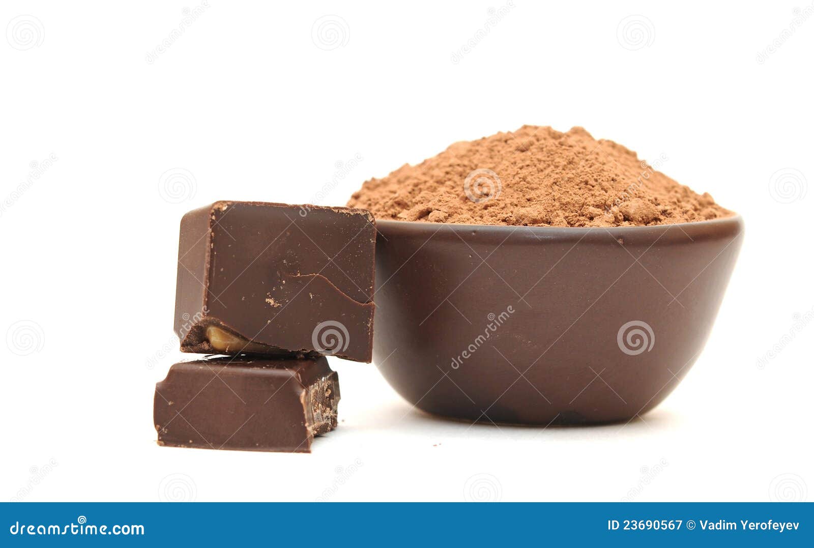 Cocoa powder and broken chocolate bar. Cocoa powder in a clay bowl and broken chocolate bar on a white background