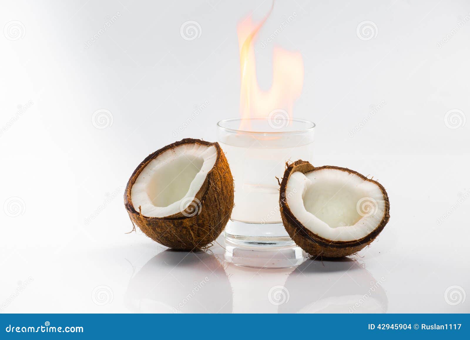 Coconut cocktail on white background with mint and fire