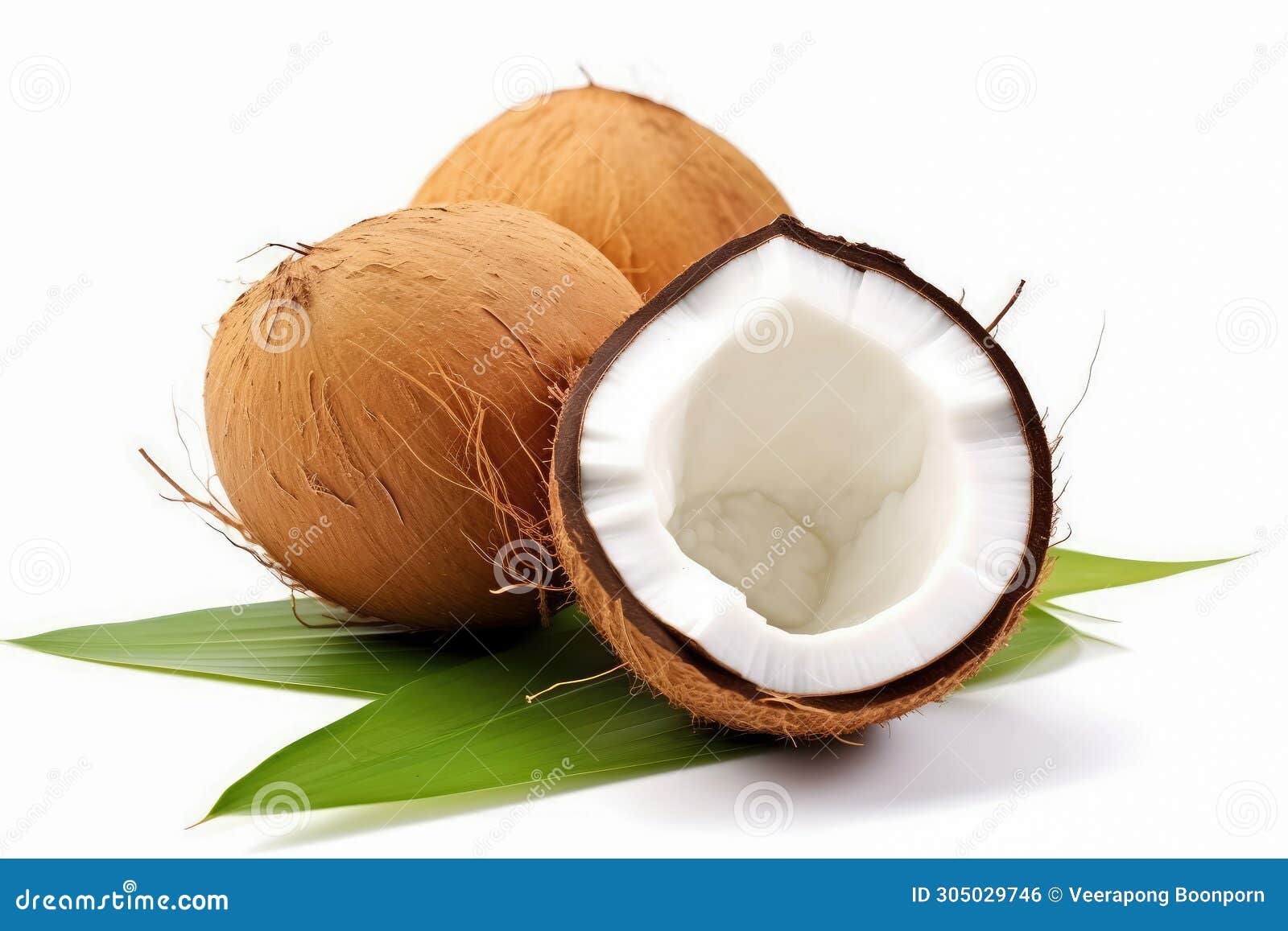 Coconut Fruit Slice Half with Green Leaves Isolated on White Background