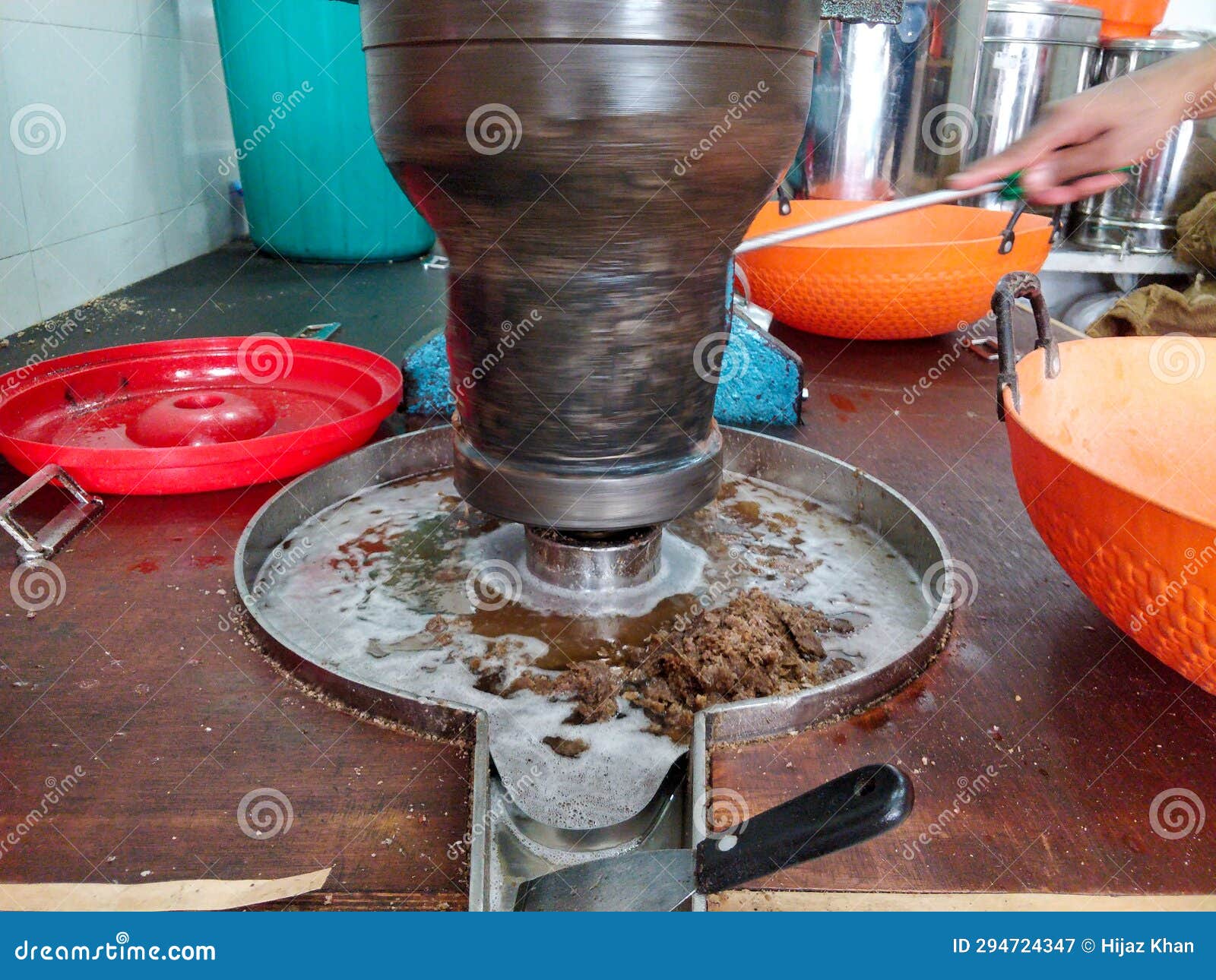 A Coconut Oil Extracting Machine Working and Oil Coming Out Stock Image ...
