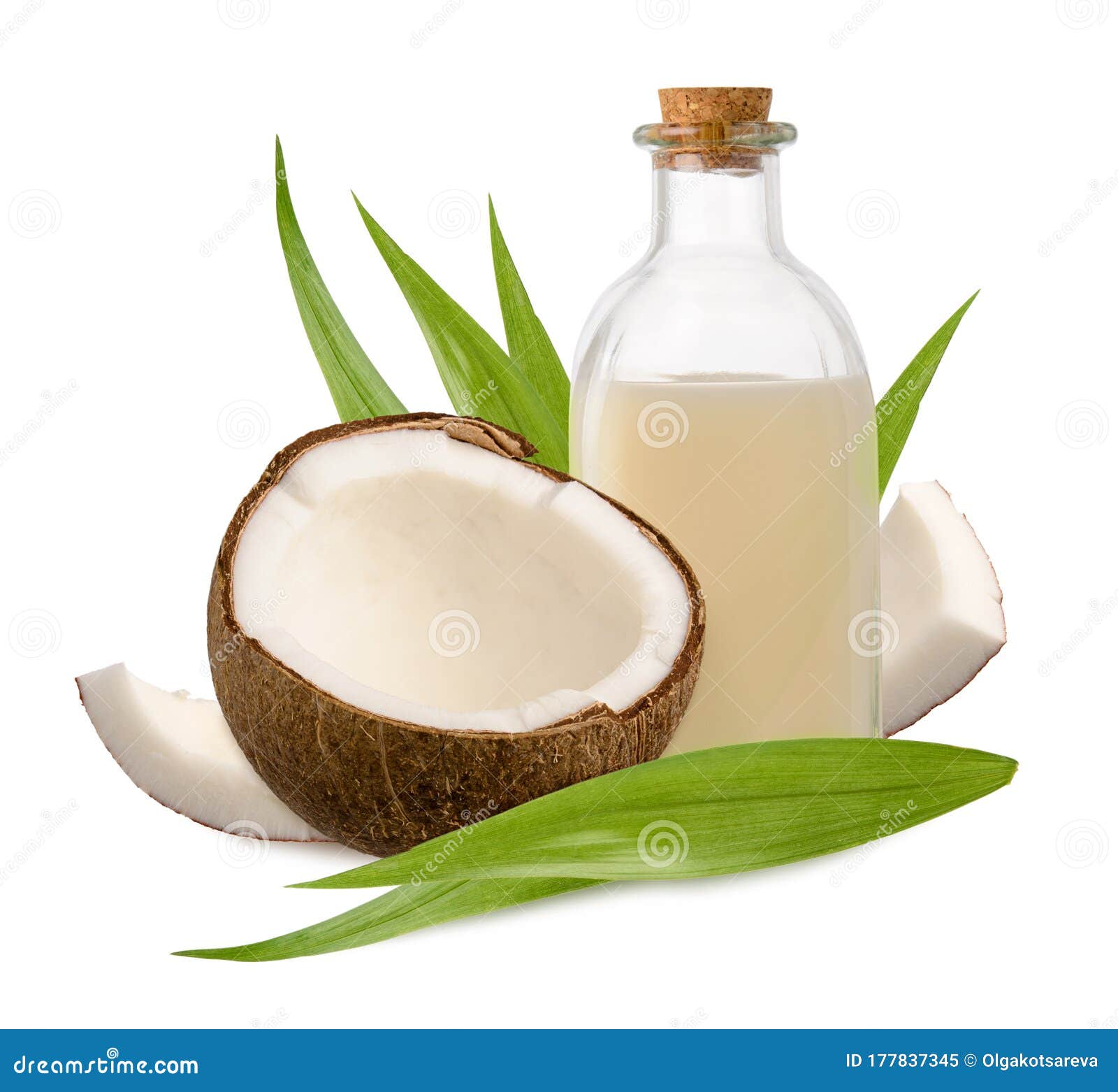 Coconut and Oil in Glass Bottle with Green Leaves Isolated on White ...