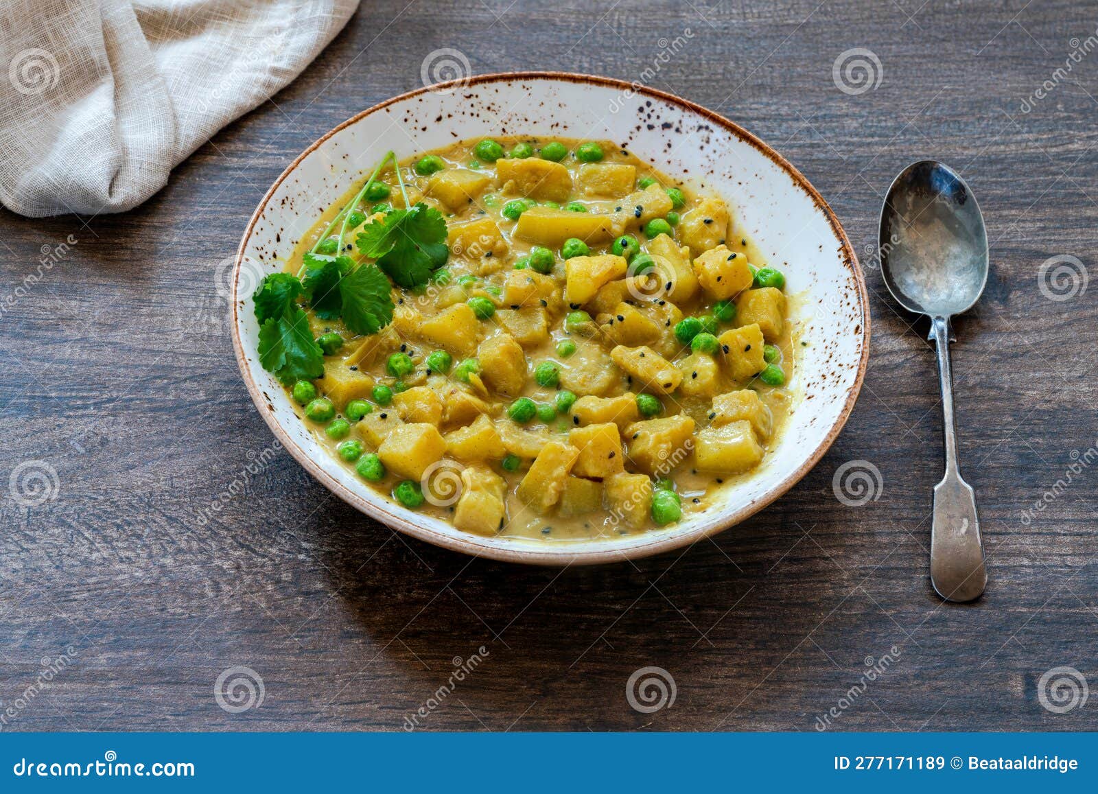Coconut and potato curry stock image. Image of garnish - 277171189