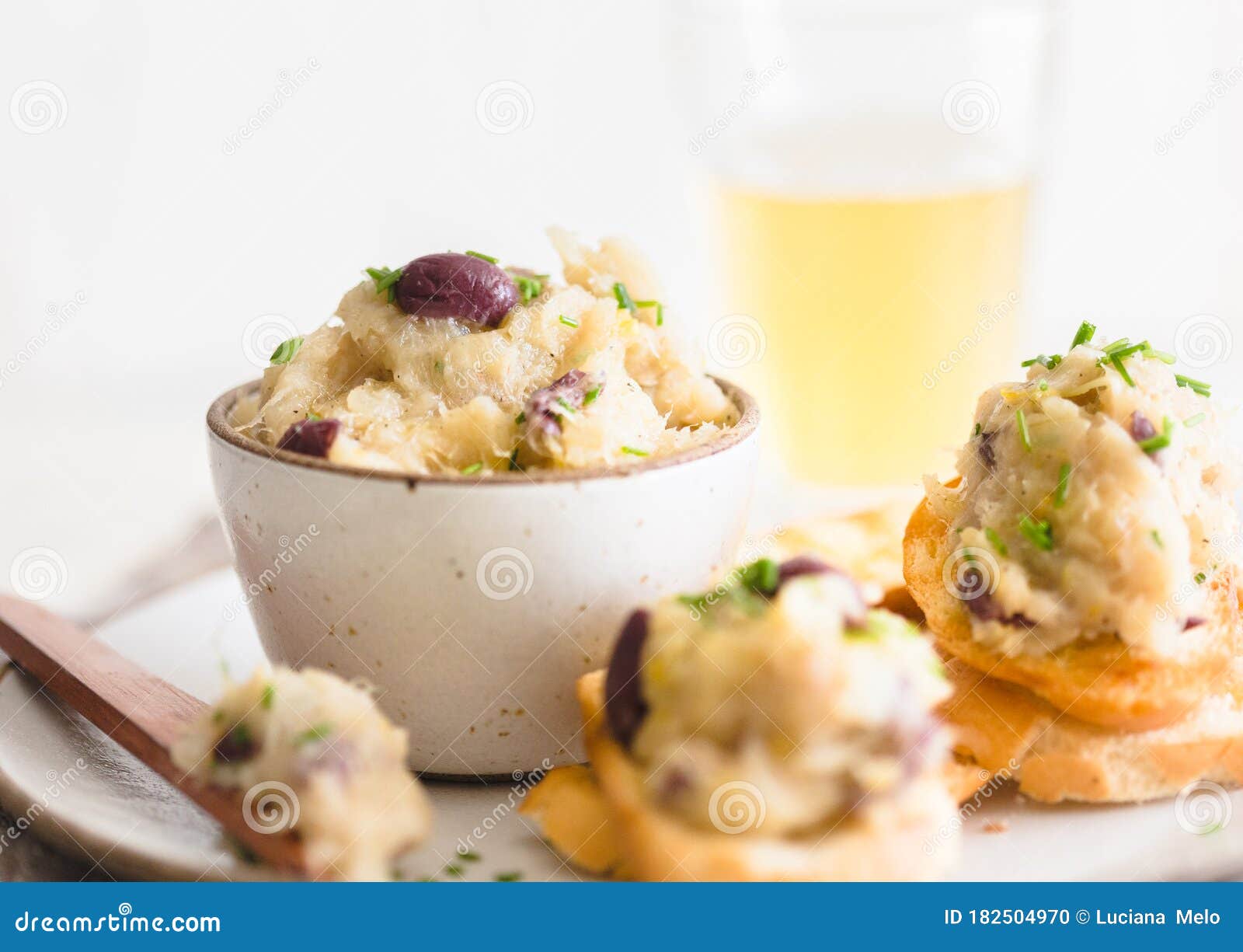 Cod Fish Brandade on a White Ceramic and Rustic Napkin Stock Photo