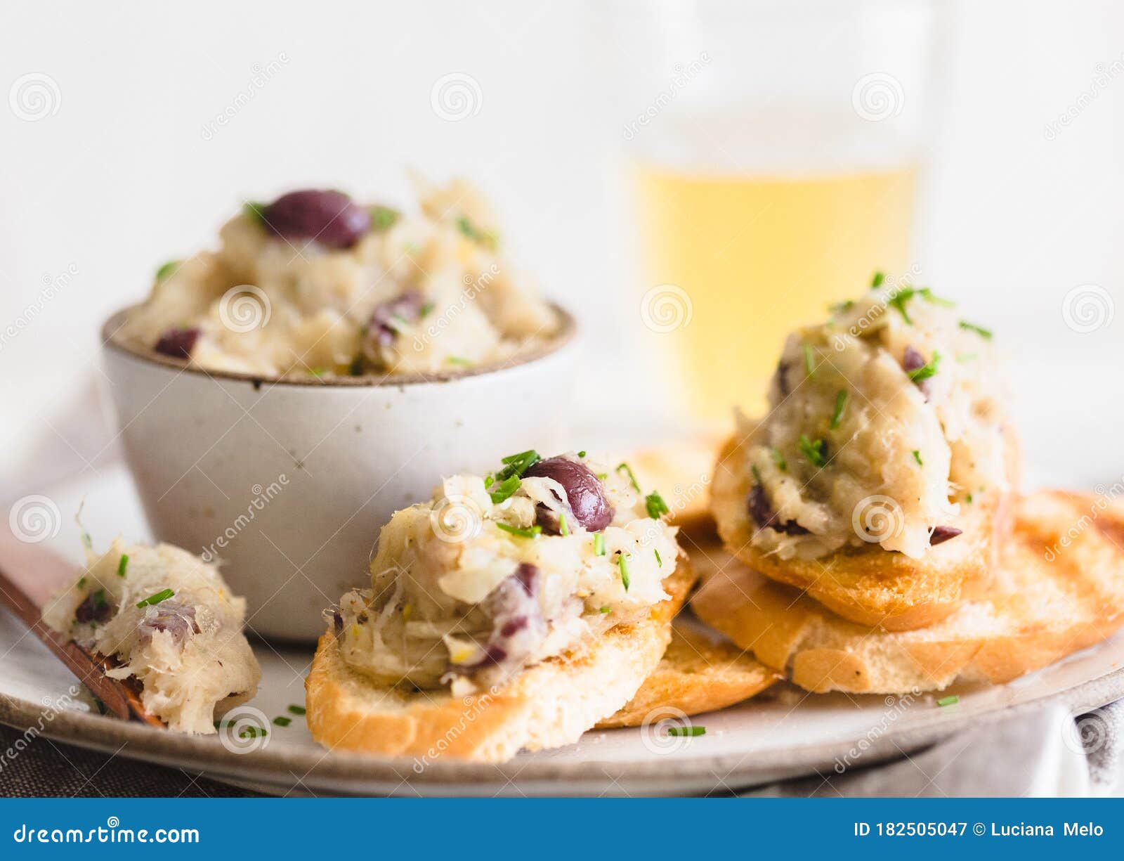 Cod Fish Brandade on a White Ceramic and Rustic Napkin Stock Image
