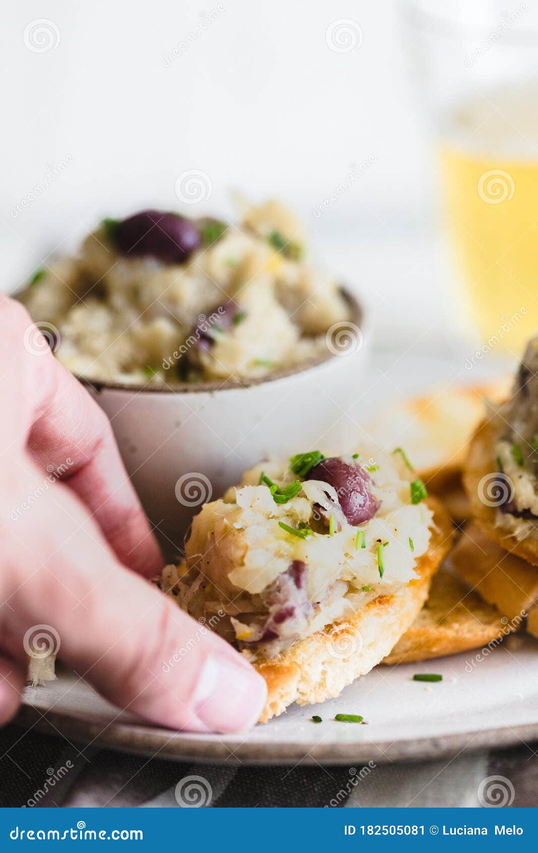 Cod Fish Brandade on a White Ceramic and Rustic Napkin Stock Image