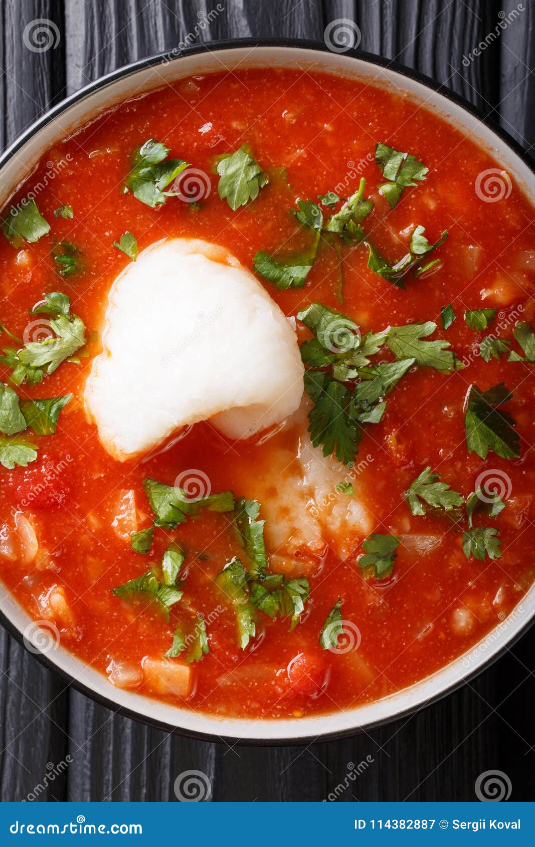 Cod Fish Tomato Soup with Celery and Parsley Close-up in a Bowl. Stock ...