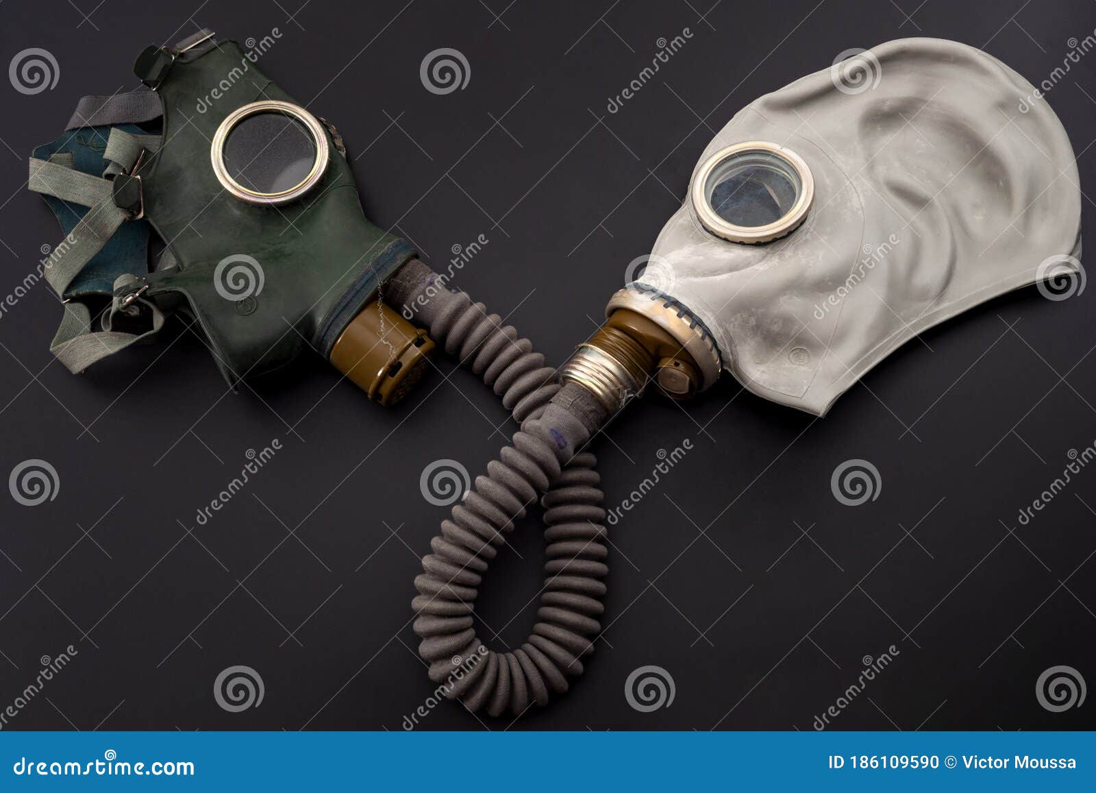 codependent relationship, negative emotions, hazardous affair and toxic love concept with two gas masks connected on the same hose