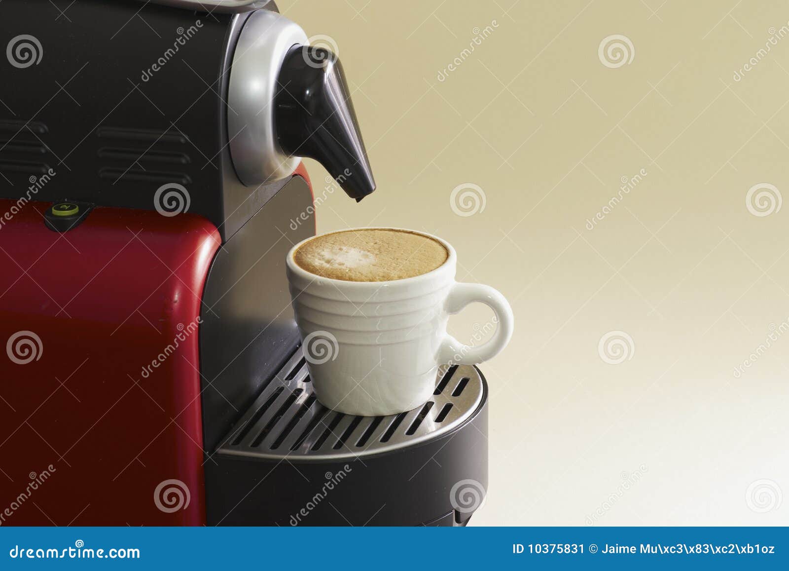 Home coffee machine, with whit cup and plain background