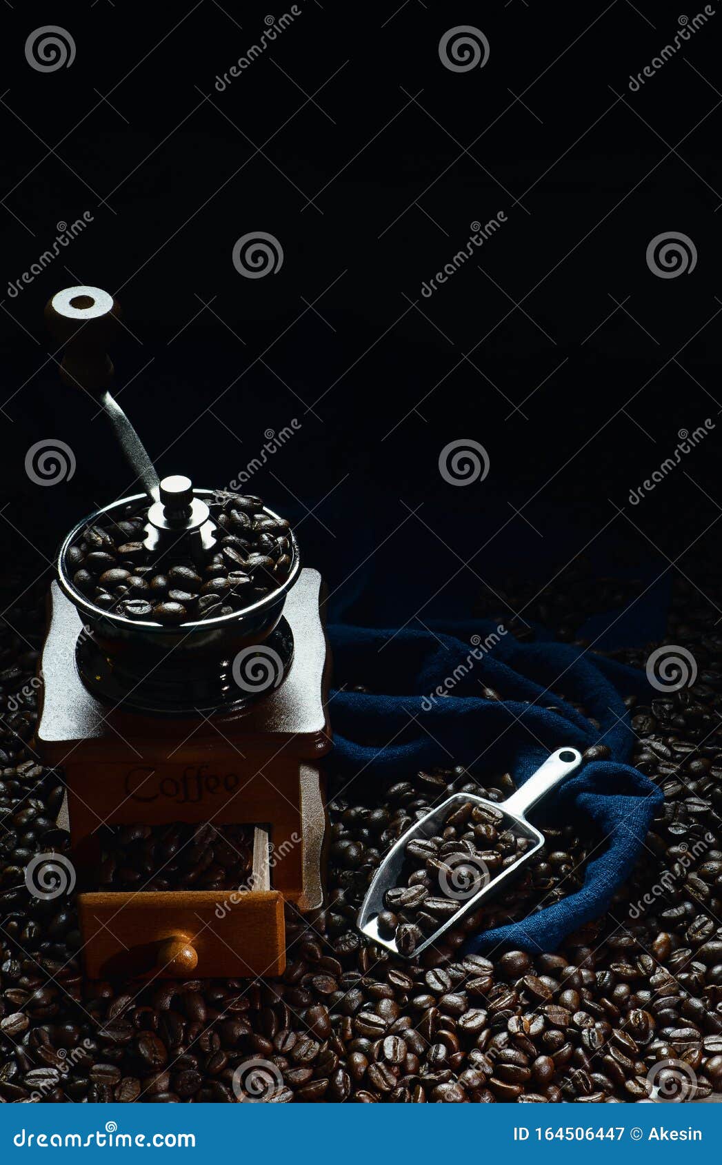 Coffee Background of Roasted Coffee Beans with Coffee Grinder and Scoop