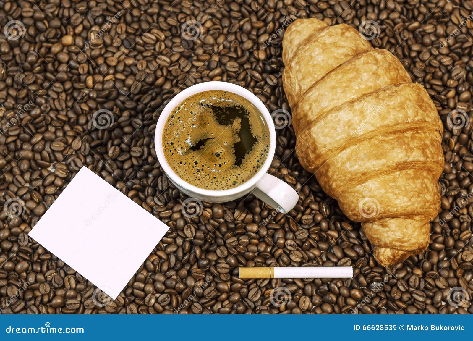 Coffee Bean Background with Cup of Fresh Hot Coffee and Plate Full of