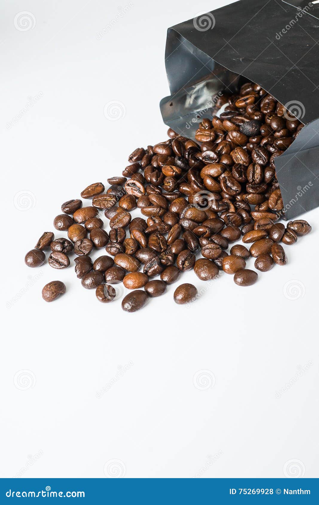 Coffee beans in black bag stock photo. Image of beverage 75269928
