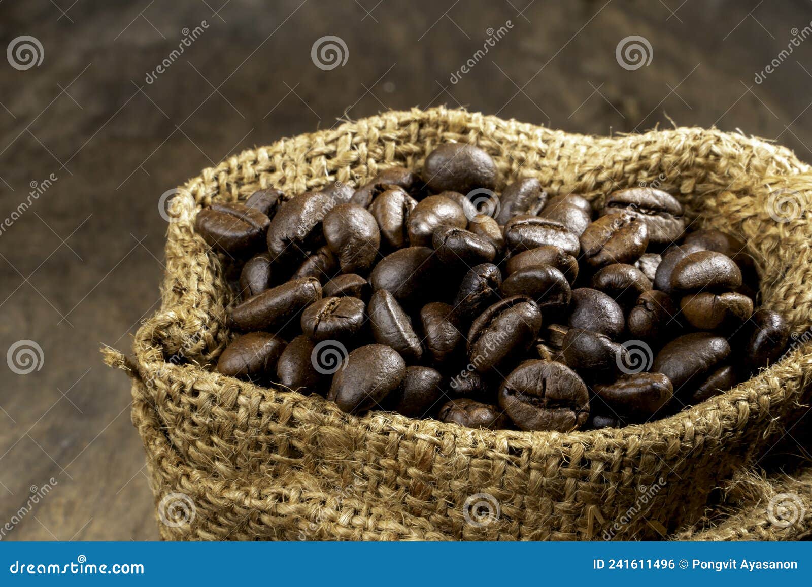 Coffee Beans in a Coffee Burlap Bag on a Wooden Surface.shallow Focus Effect Stock Photo Image