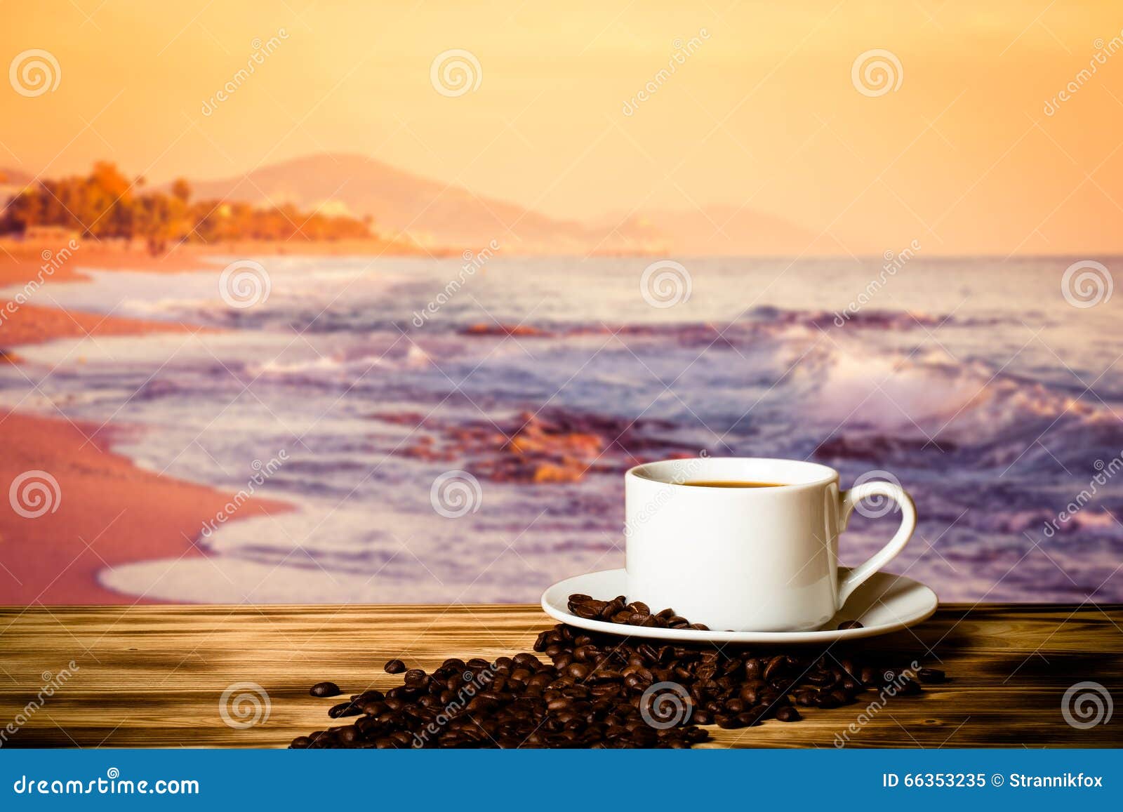 coffee beans and coffee in cup on wooden table opposite a blurred background