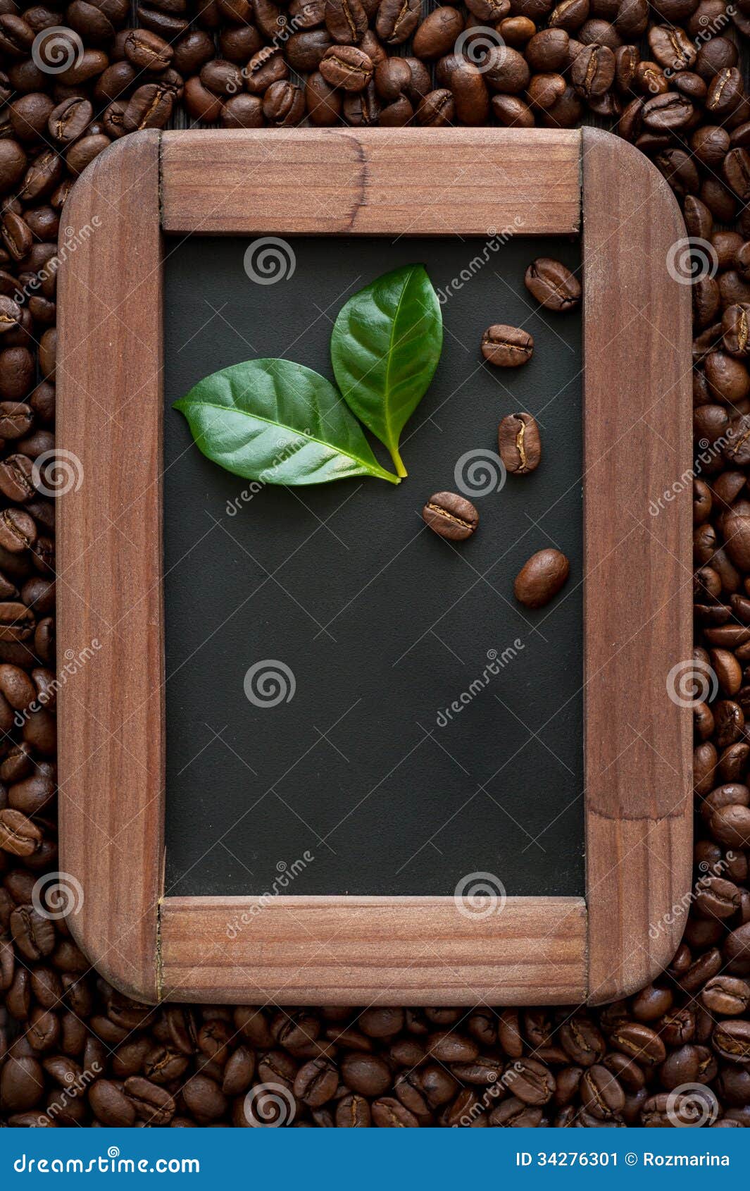 Coffee Beans with Green Leaves on the Chalkboard Menu Stock Image